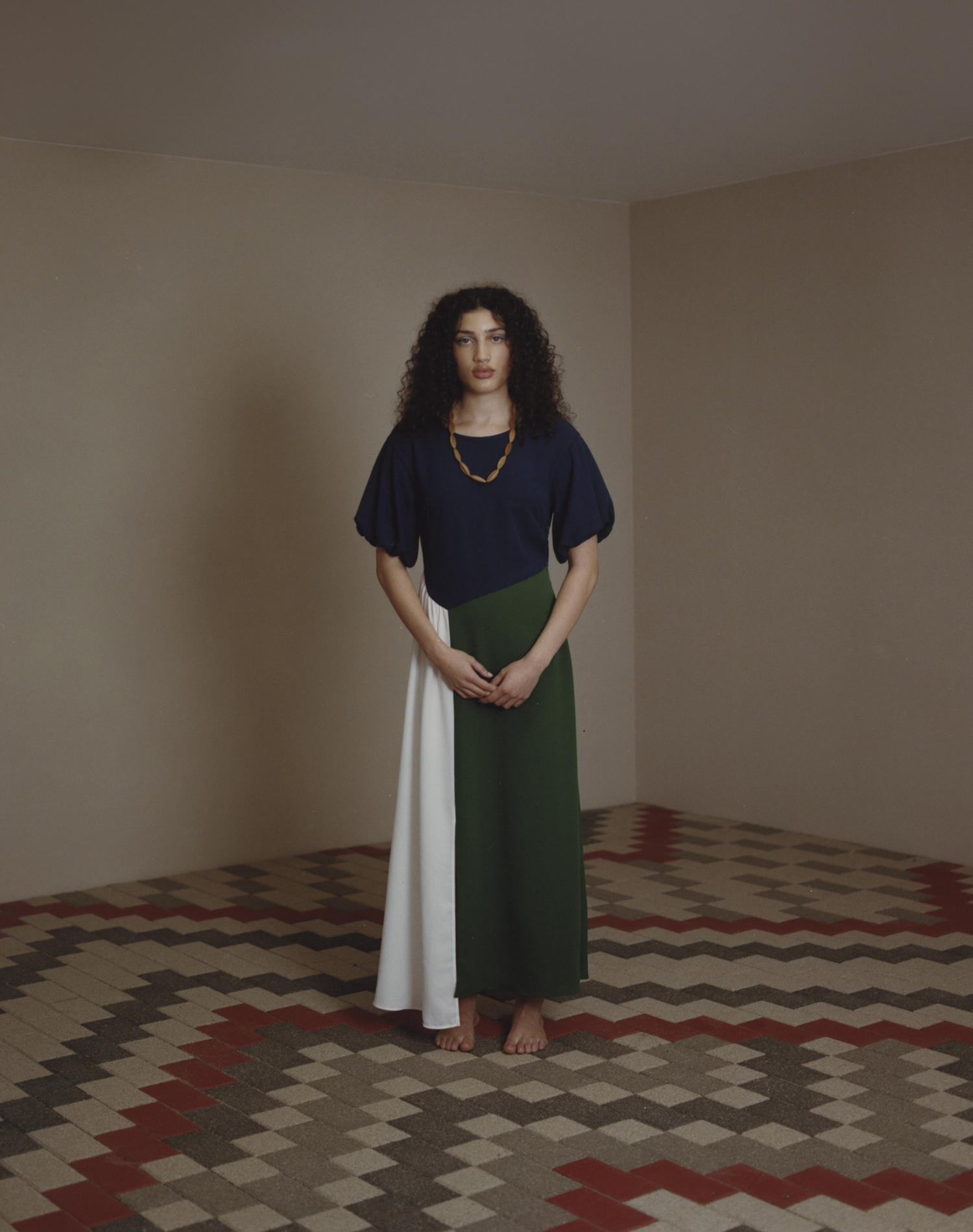 Leonie wears Kate Sylvester dress. Artwork ‘Ngā Whāriki Manaaki’ by expert weavers Reihana Parata QSM (Aunty Doe) and Morehu Flutey-Henare (Nanny Mū), with technical support from Wayne Youle, as part of the exhibition Pohewa Pāhewa: A Māori Design Kaupapa, curated by Desna Whaanga-Schollum, Tyrone Ohia, Graham Tipene, Johnson Witehira and Zoe Black, at Objectspace. Photo / Rob Tennent