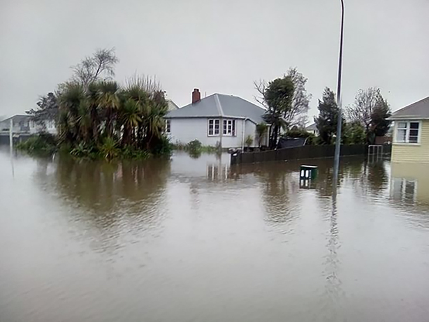 A flooded Westport in July 2021. Scientists later calculated climate change to have made the deluge that caused it about 10 per cent more intense. Photo / Samuel Smith