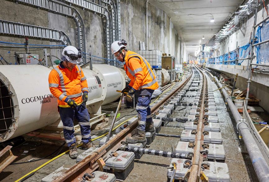 Workers finish up laying tracks near the CRL’s Te Waihorotiu Station.