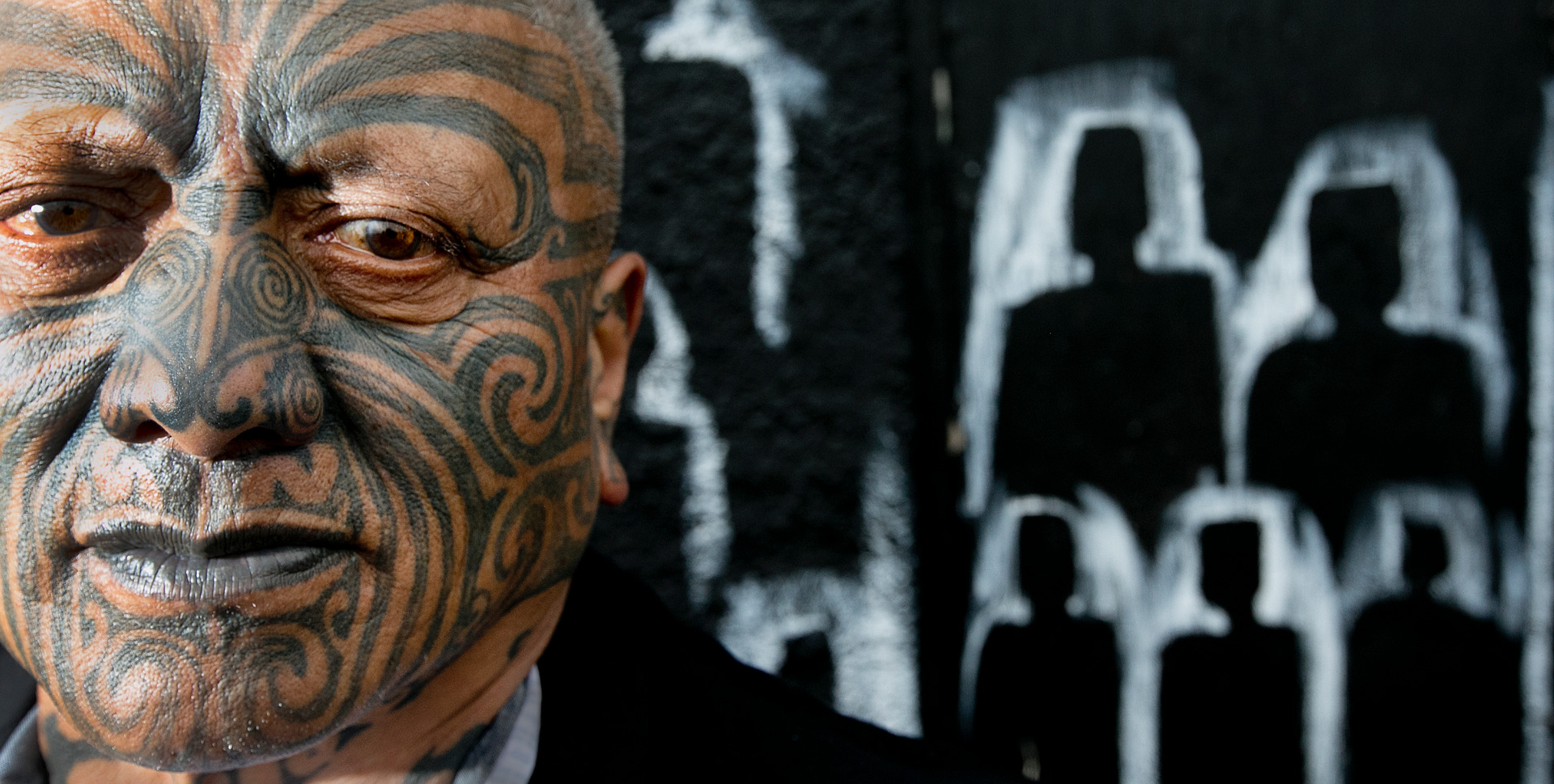 Tuhoe artist Tame Iti with some of his art in Taneautua, 2017. Photo / Alan Gibson
