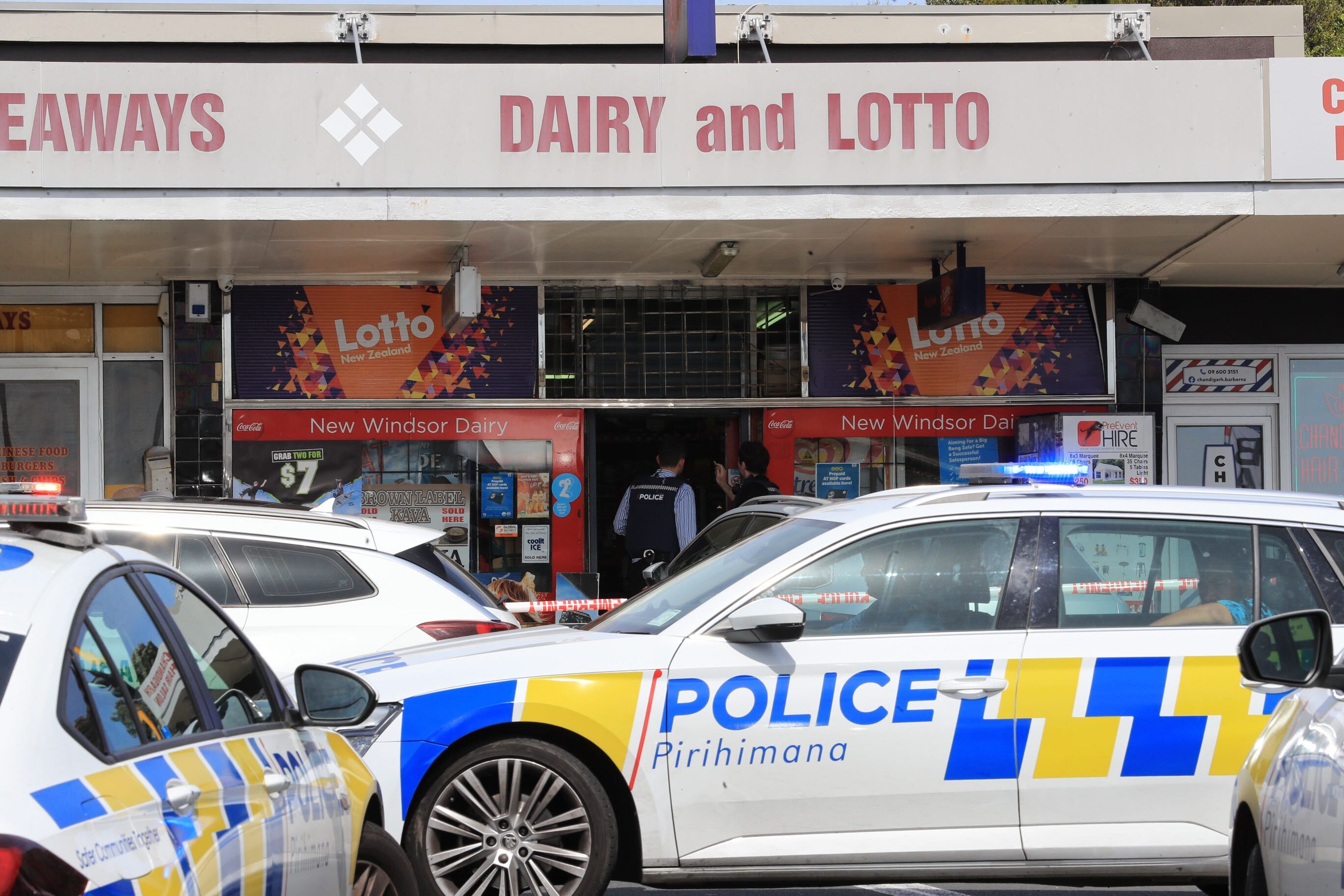 Two people were stabbed - one of them receiving critical injuries - at an armed robbery at this Auckland dairy. Photo / Hayden Woodward