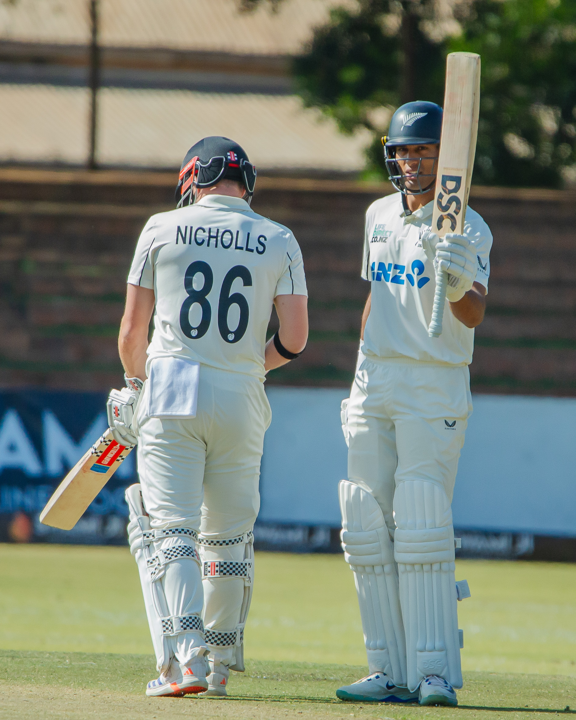 Rachin Ravindra celebrates his half-century on day two of the second test between the Black Caps and Zimbabwe in Bulawayo. Photo / Zimbabwe Cricket