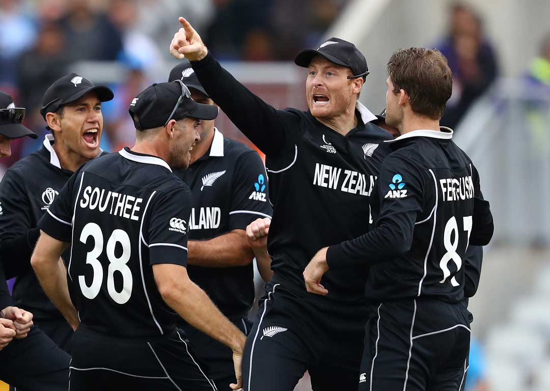Martin Guptill points to the stands after running out MS Dhoni. Photo /Getty