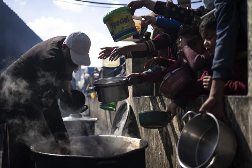 Palestinians line up for a free meal in Rafah, Gaza Strip. Photo / AP