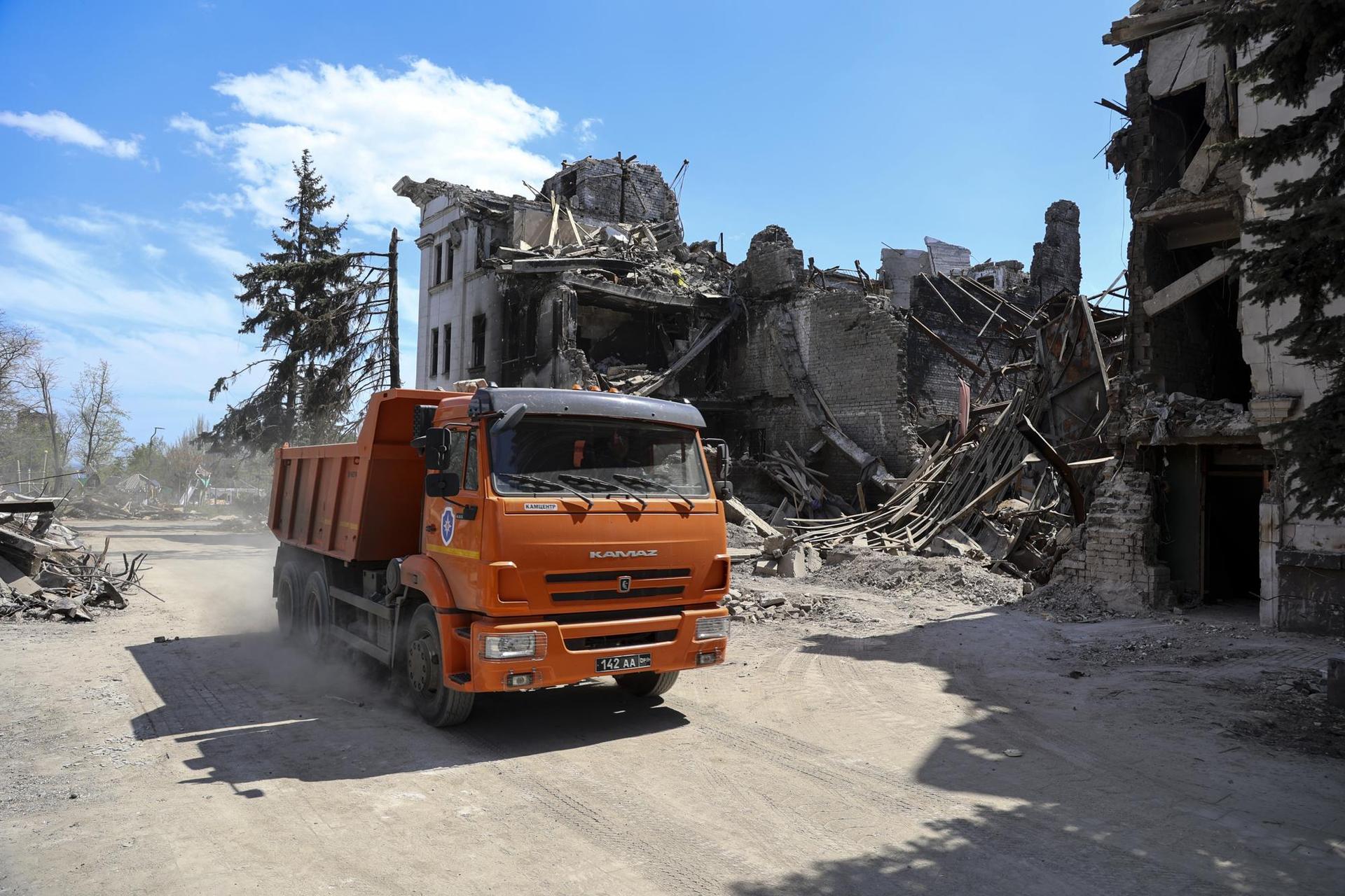 A truck drives past the Donetsk Academic Regional Drama Theatre in Mariupol, Ukraine. Photo / AP