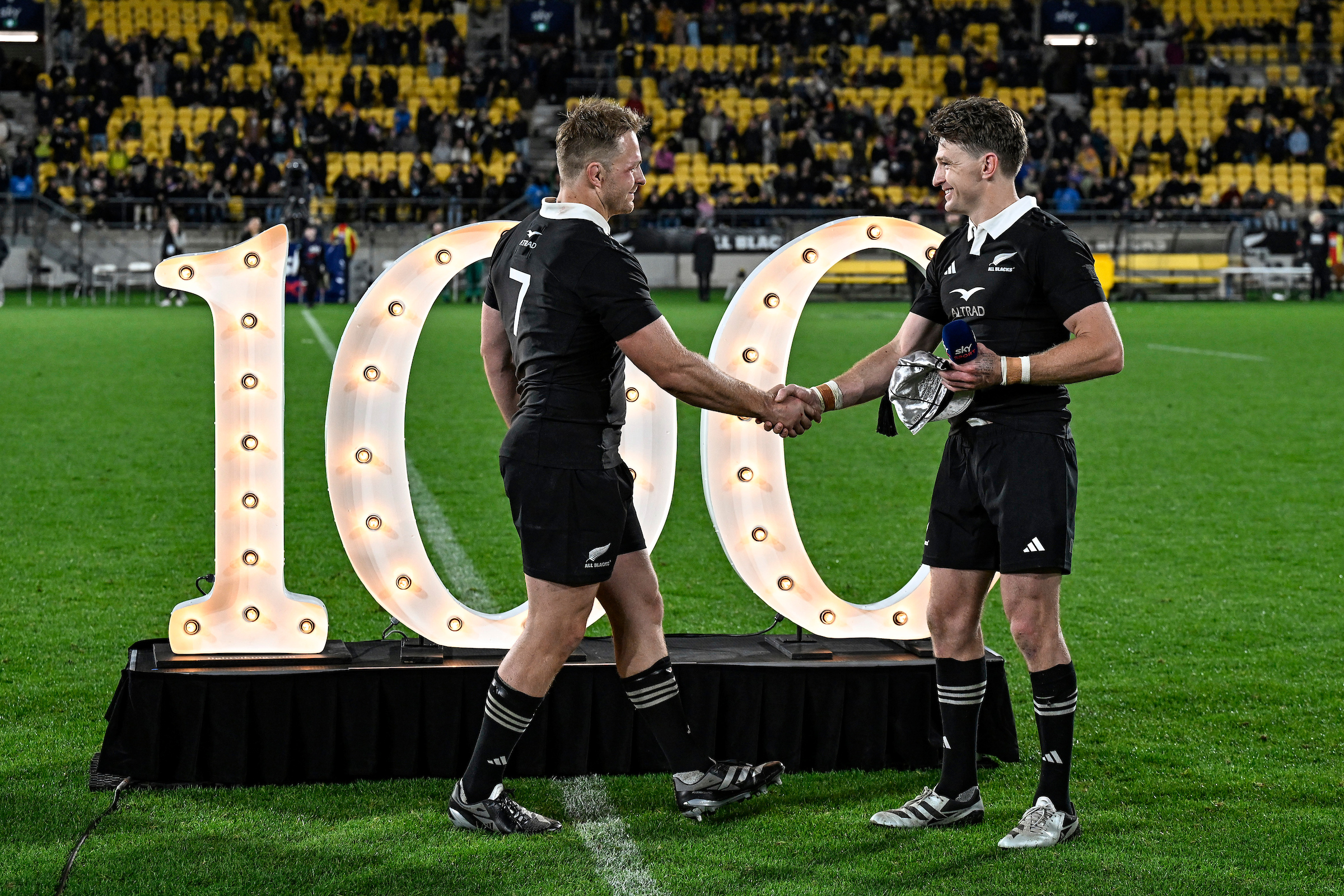 Beauden Barrett presents Sam Cane with his 100th test cap on September 28. Photo /Photosport