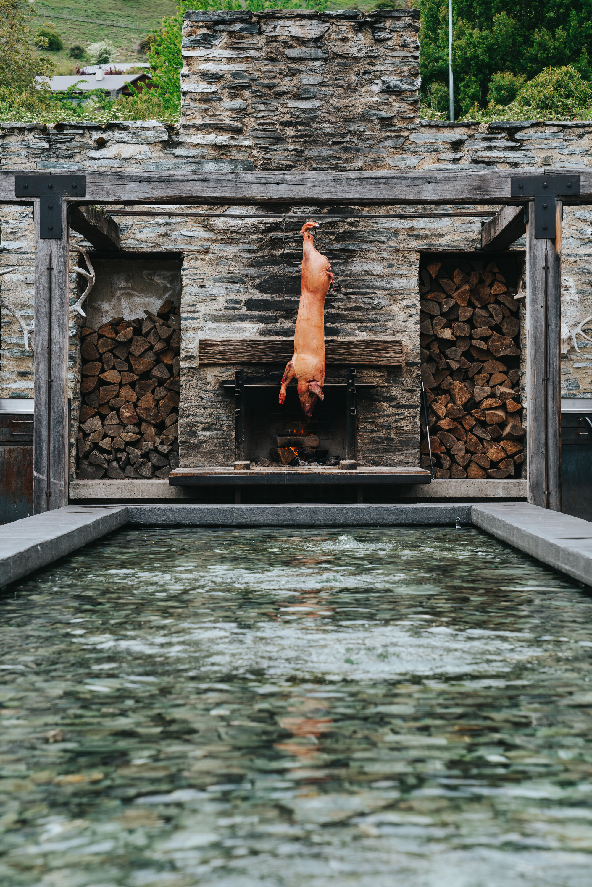 Boar cooking over the open fire outside Amisfield restaurant, Queenstown. Photo / Sam Stewart