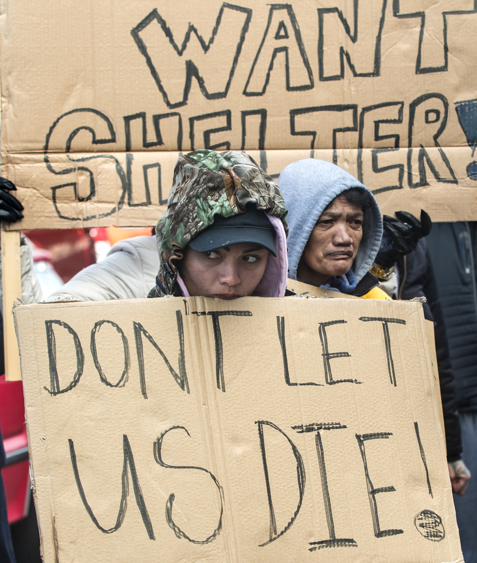 Rotorua residents rally with their signs at Hīkoi for Homeless. Photo / Stephen Parker
