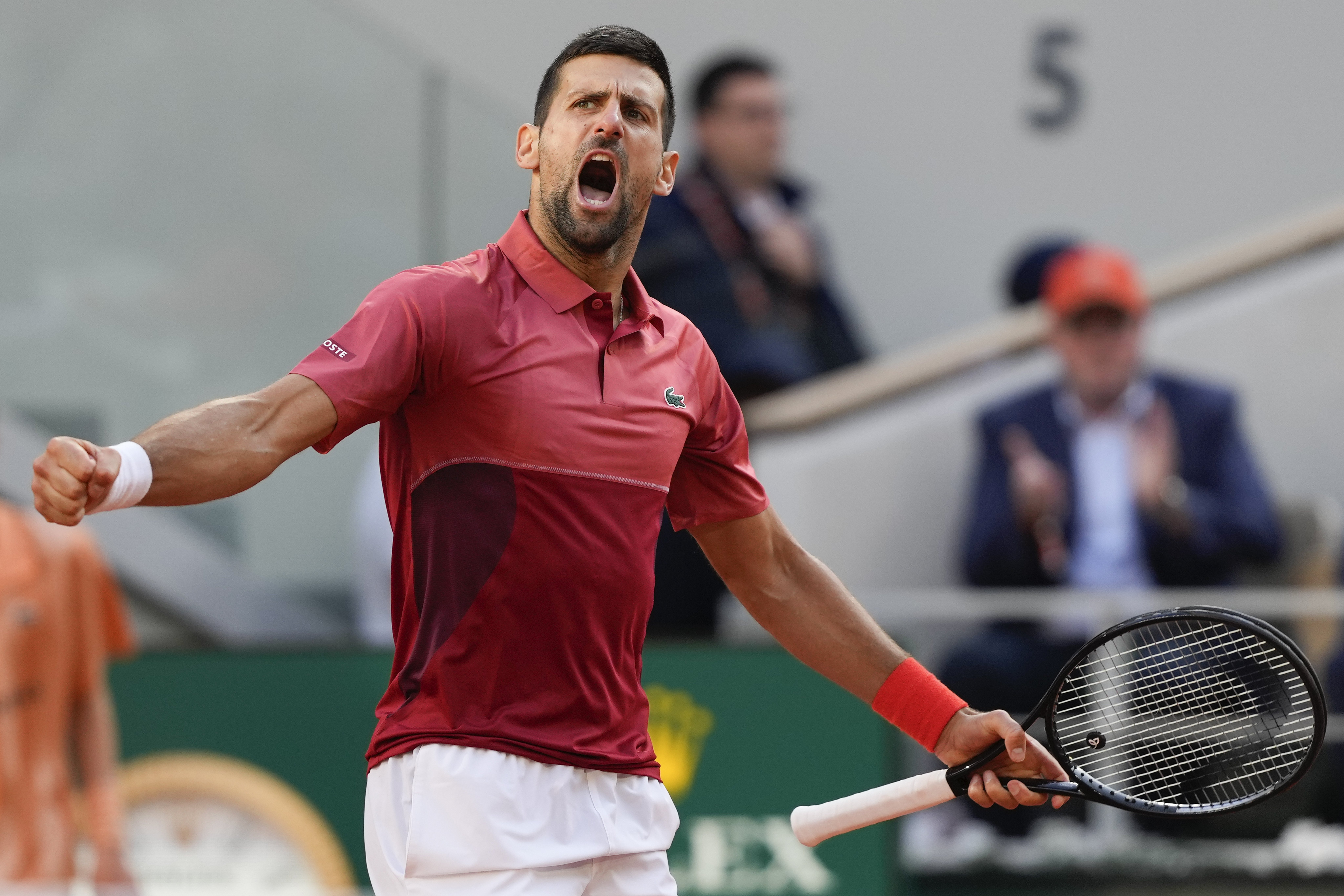 Serbia's Novak Djokovic clenches his fist after holding his service game and reaching 5-5 in the fourth set during his fourth round match of the French Open tennis tournament against Argentina's Francisco Cerundolo. Photo / AP