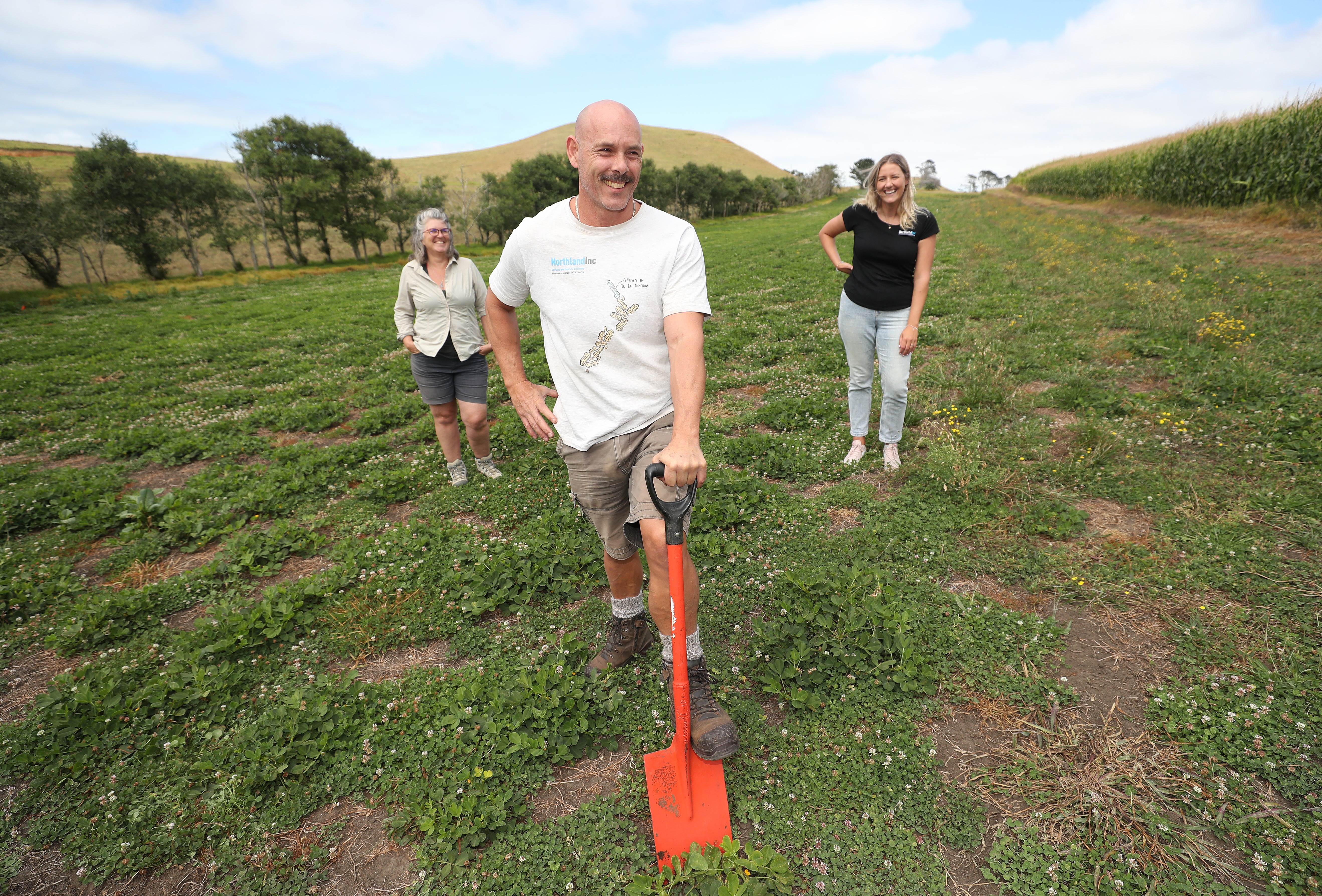 Jeanette Johnstone (left) and Hannah MacKay (right) at the Pouto trial site with Greg Hall. Photo / Michael Cunningham