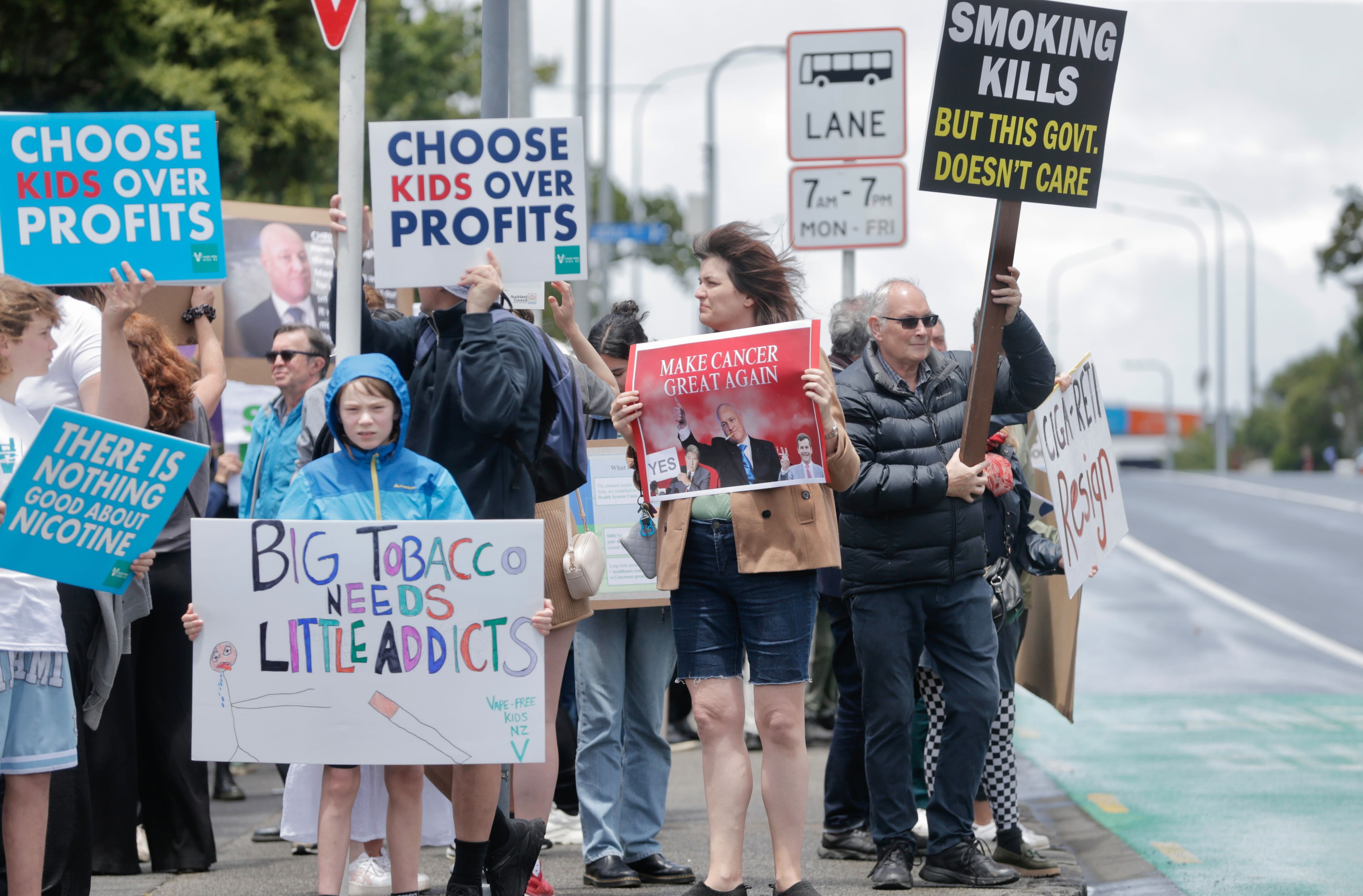 People gather near Auckland City Hospital to protest the government's plan to repeal smokefree laws.