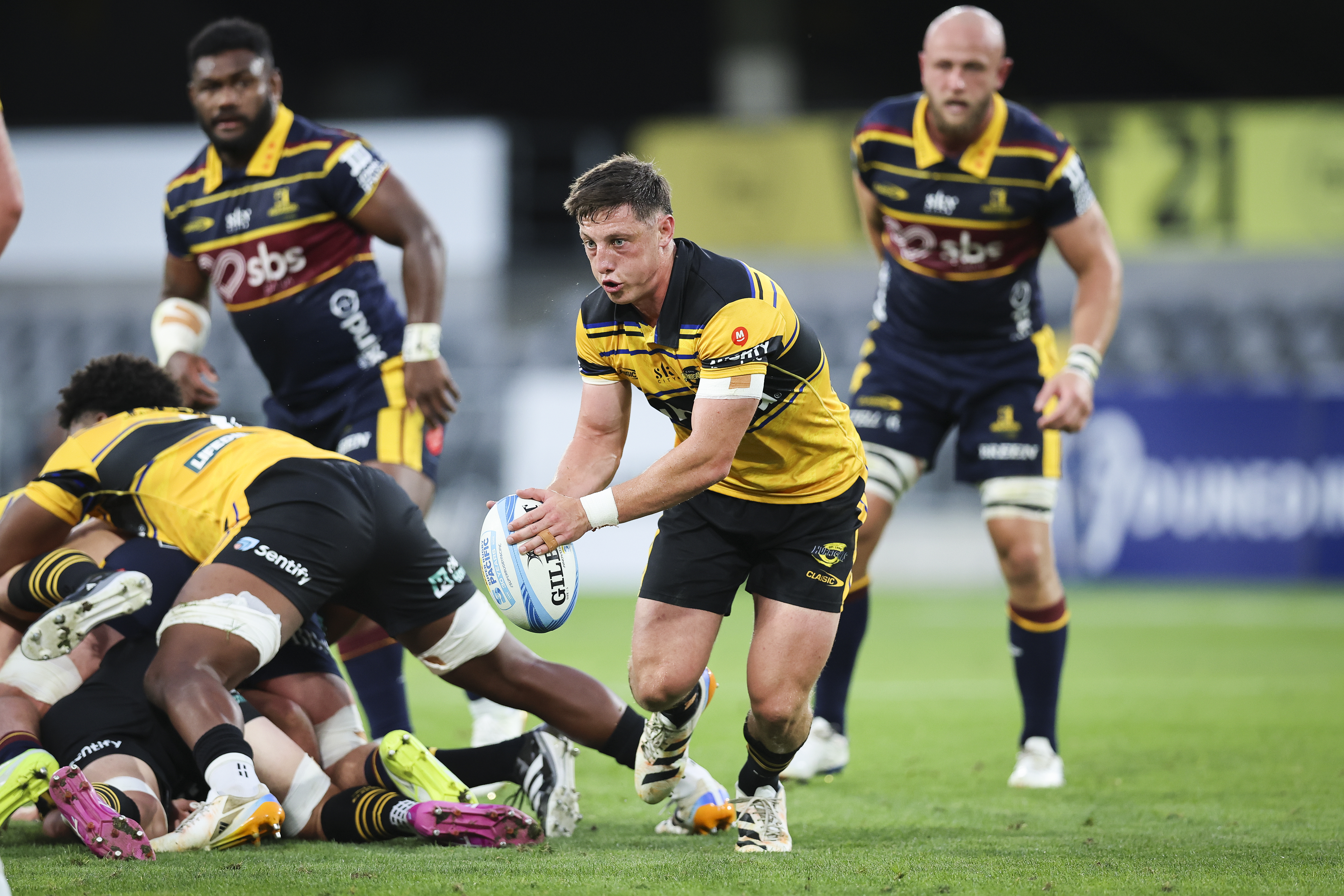 Hurricanes halfback Cam Roigard looks for space in their match against the Highlanders. Photo / SmartFrame