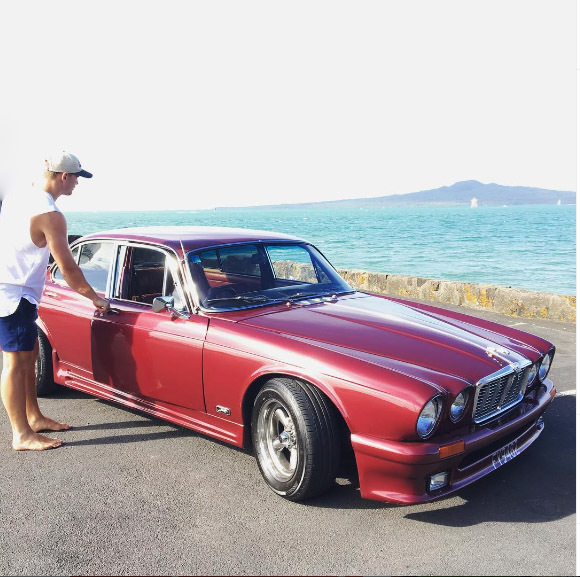 Papalii with his modified Jaguar. Photo / Supplied