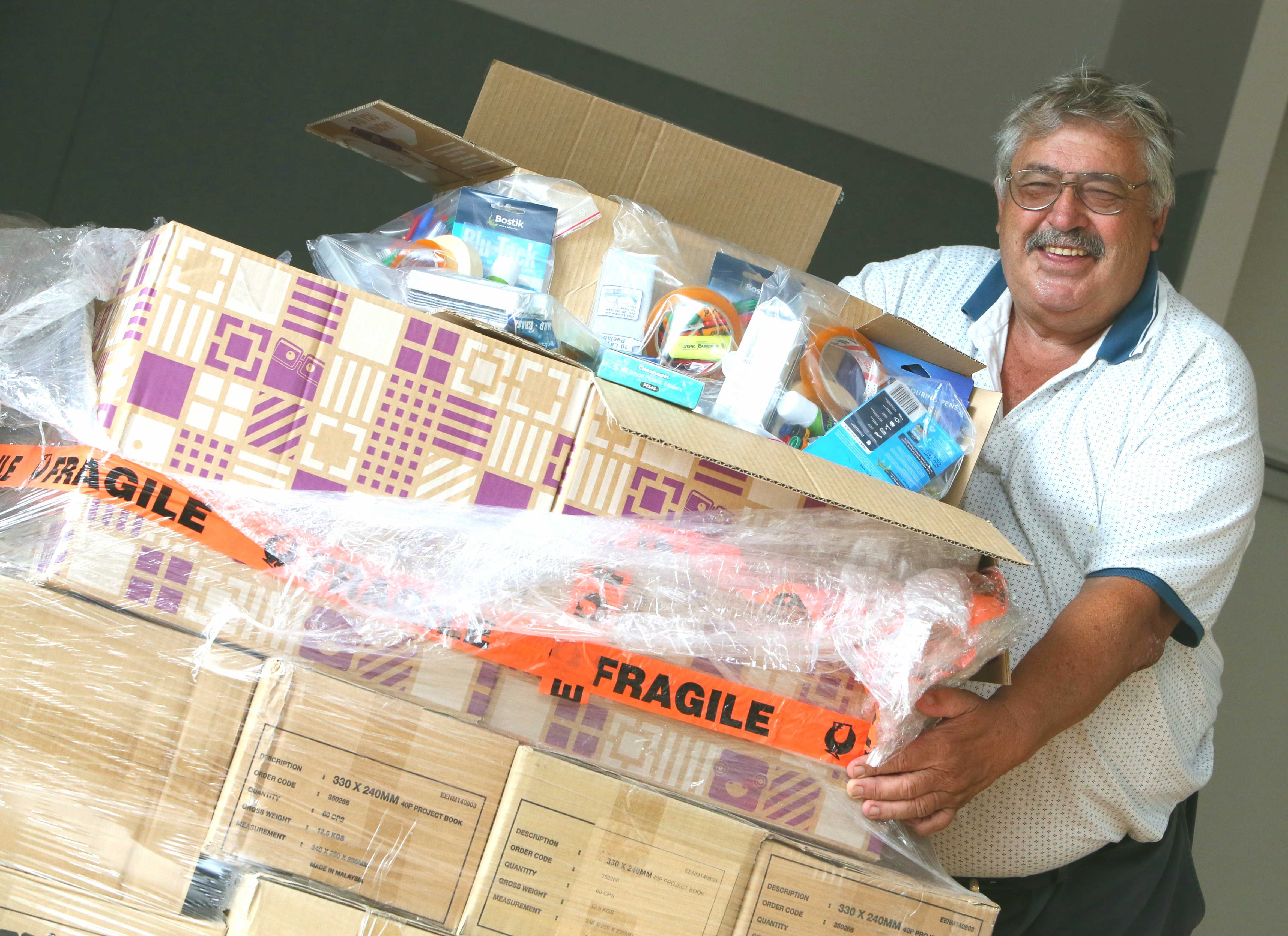 Hora Hora Primary School principal Pat Newman with student packages for term one last year. Photo / Tania Whyte