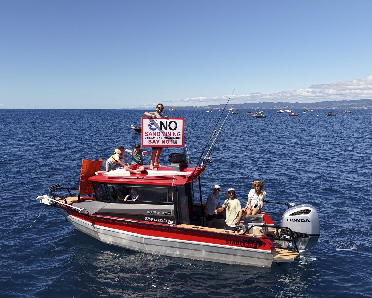  About 50 boats took to the water on Sunday to protest McCallum Brothers' sand mining plans for Bream Bay and were treated to fine weather. Photo / Geoff Reid
