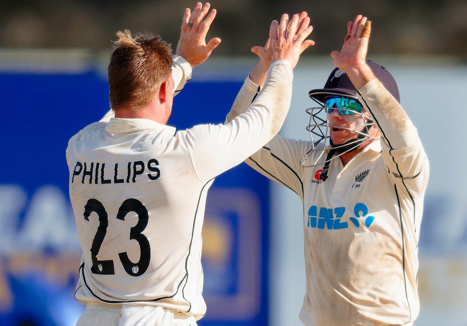 Glenn Phillips celebrates a wicket with Tom Latham. Photo / Sri Lanka Cricket