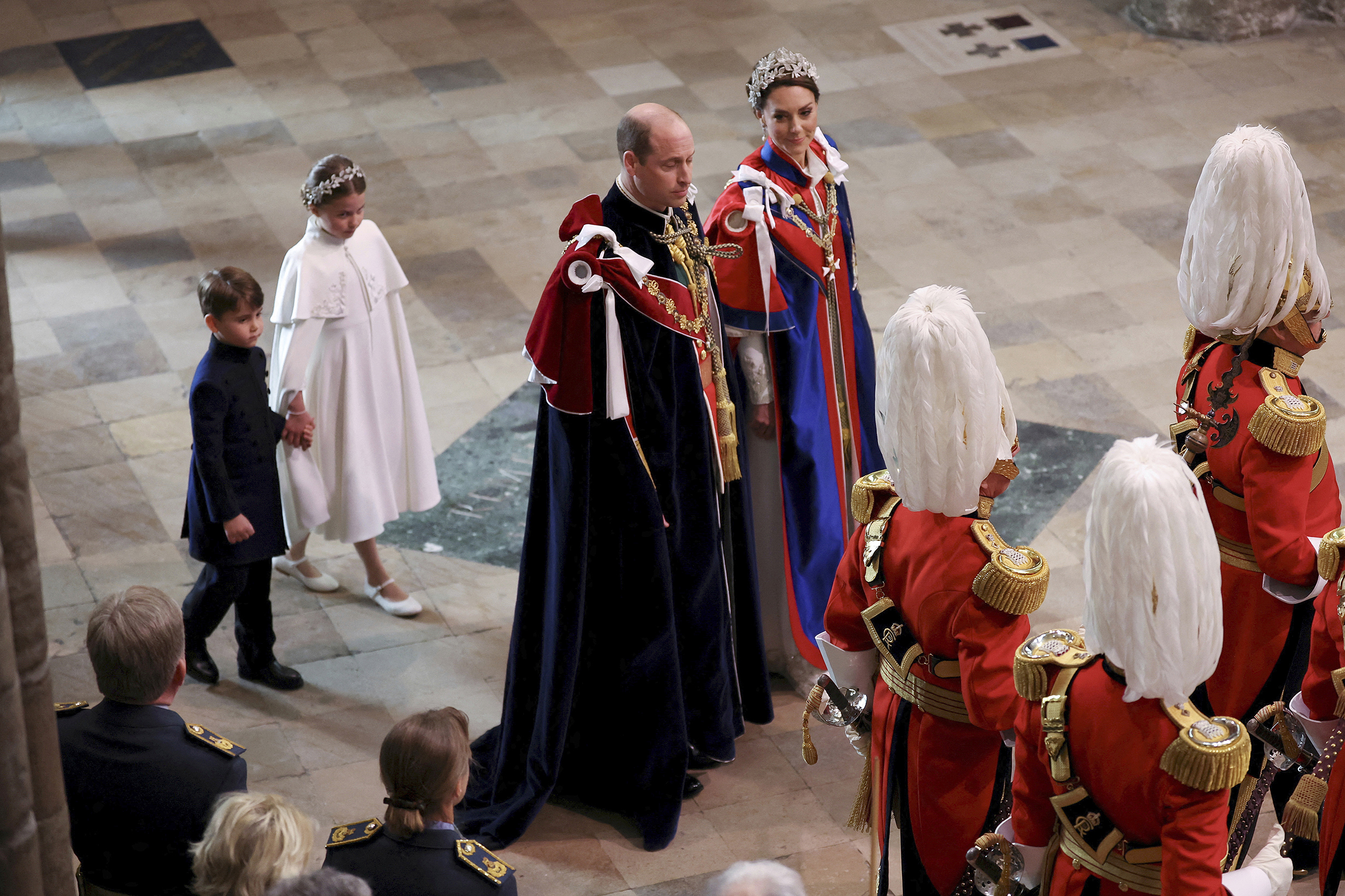 Prince William and Princess Catherine, followed by Princess Charlotte and Prince Louis, arrive at the coronation of King Charles at Westminster Abbey. Photo / AP