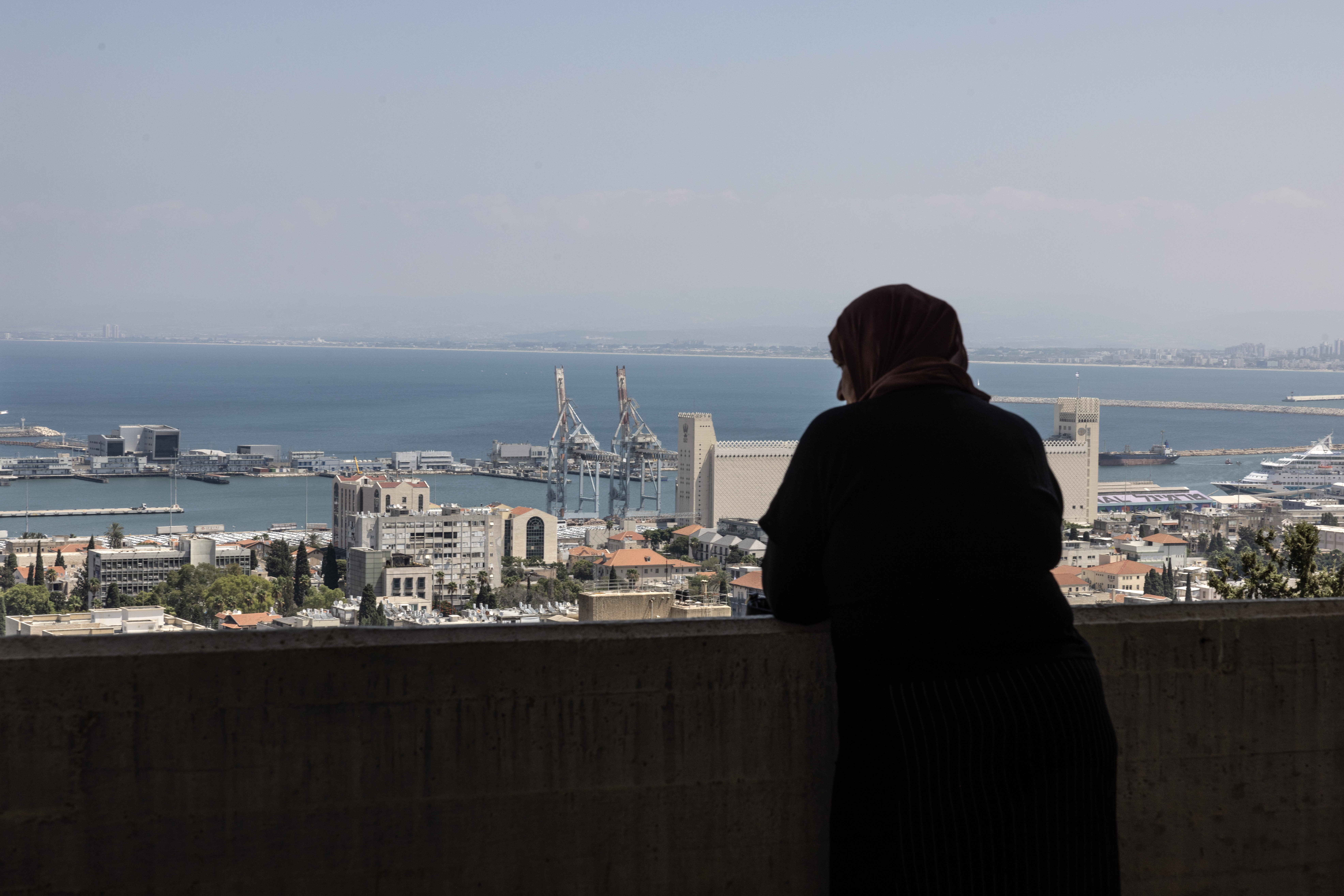 Nadia Hashmar, a Palestinian citizen of Israel, looks out from her apartment in Haifa, Israel, on Sunday. Photo / Heidi Levine for The Washington Post