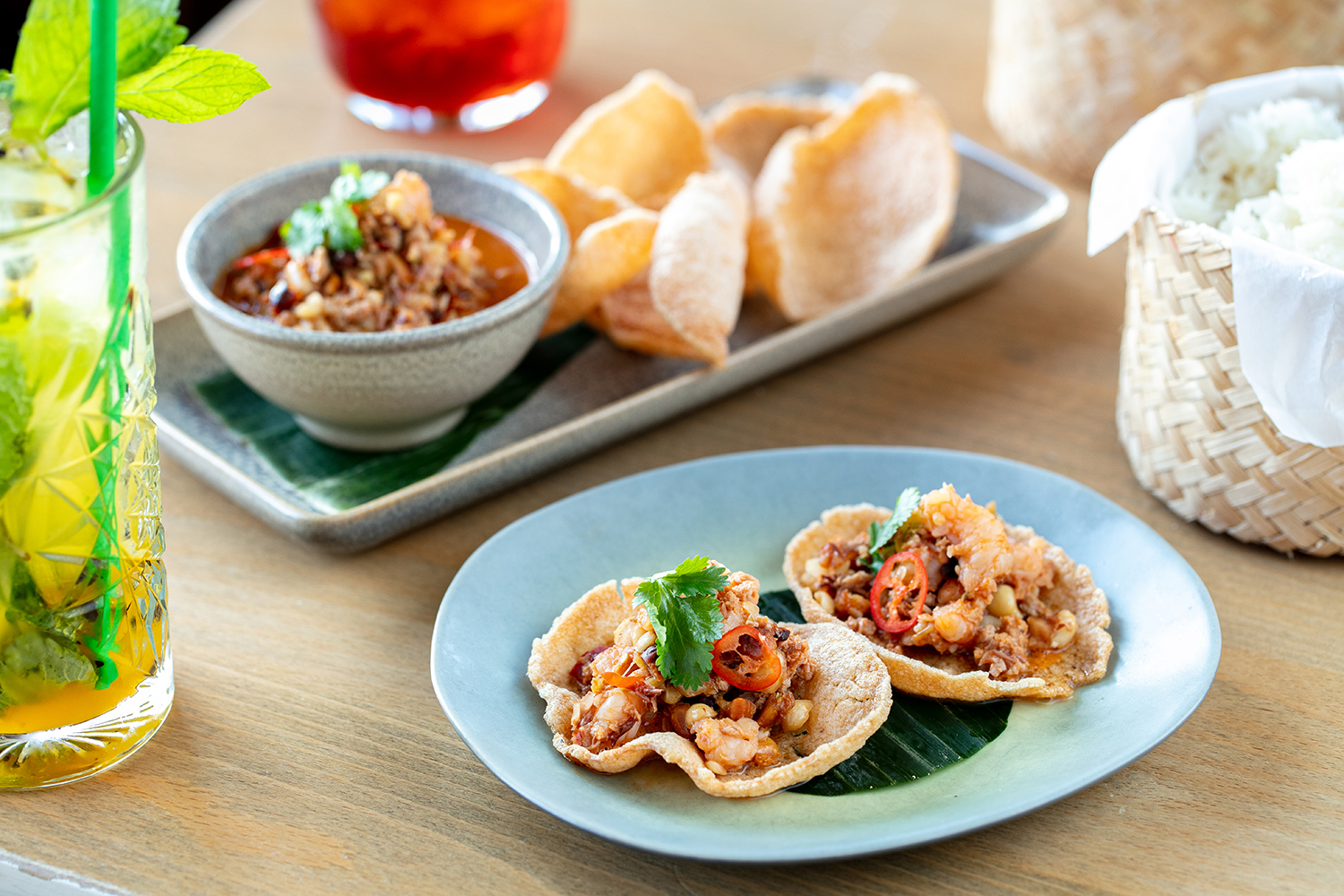 Thai prawn crackers topped with pork and fresh chilli. Photo / Babiche Martens