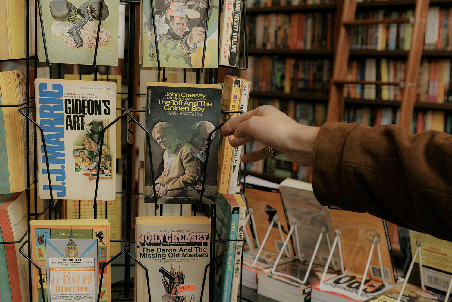 Emma Corrin looks at books at the Mysterious Bookshop. Photo / Jeenah Moon, The New York Times