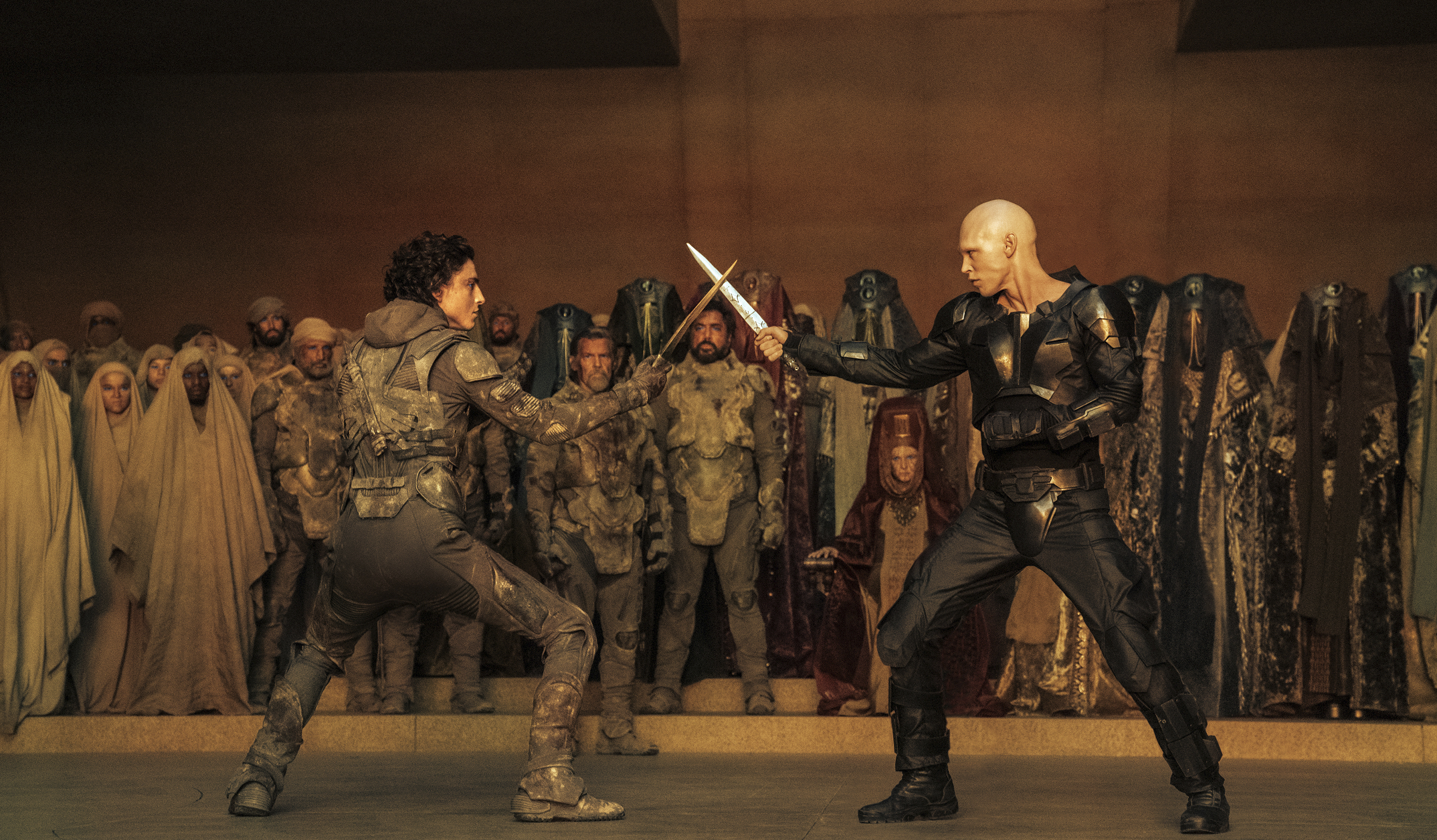 This image released by Warner Bros. Pictures shows Timothee Chalamet, foreground left, and Austin Butler in a scene from 