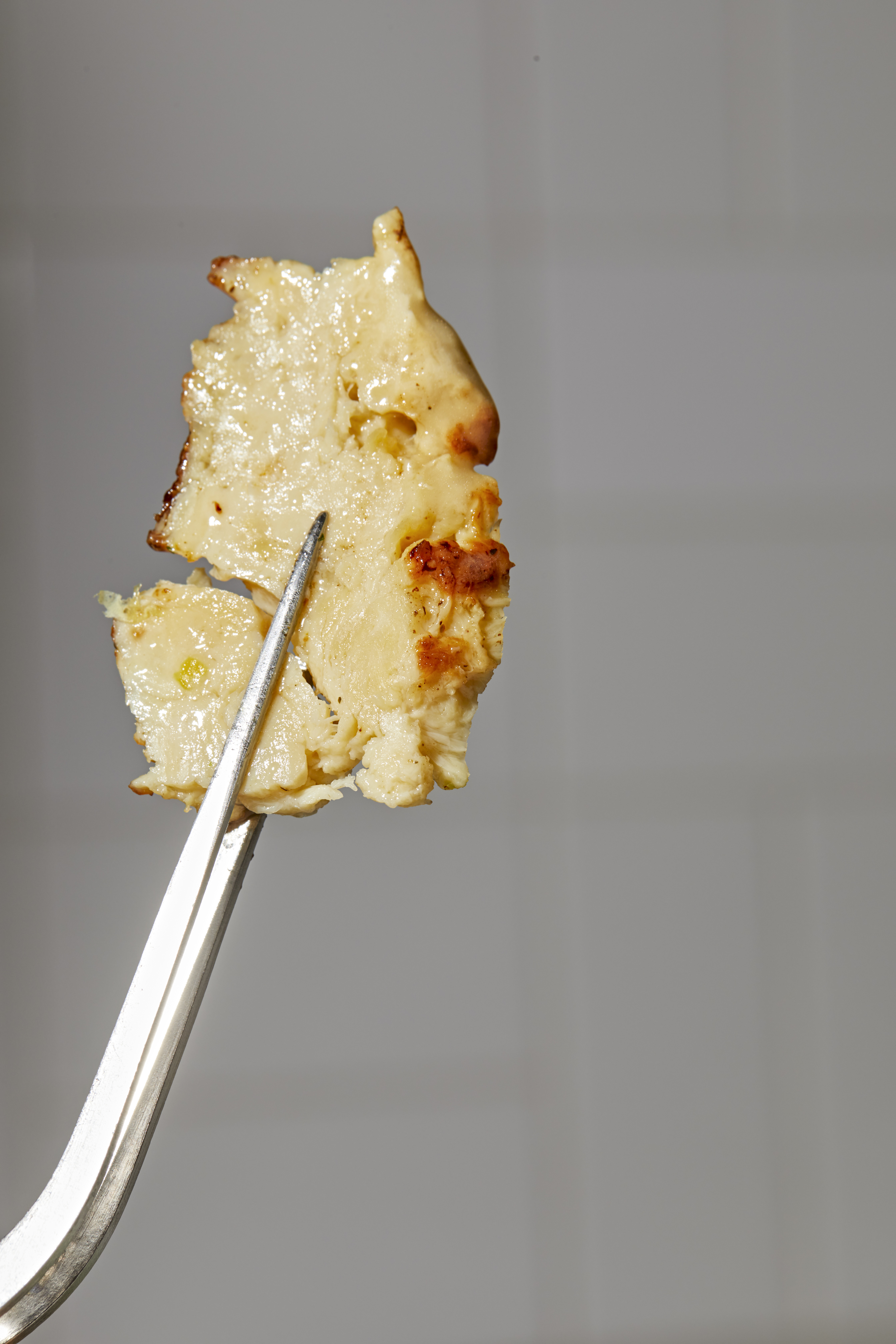 A bite of chicken breast grown from stem cells at Upside Foods in California. Photo / New York Times
