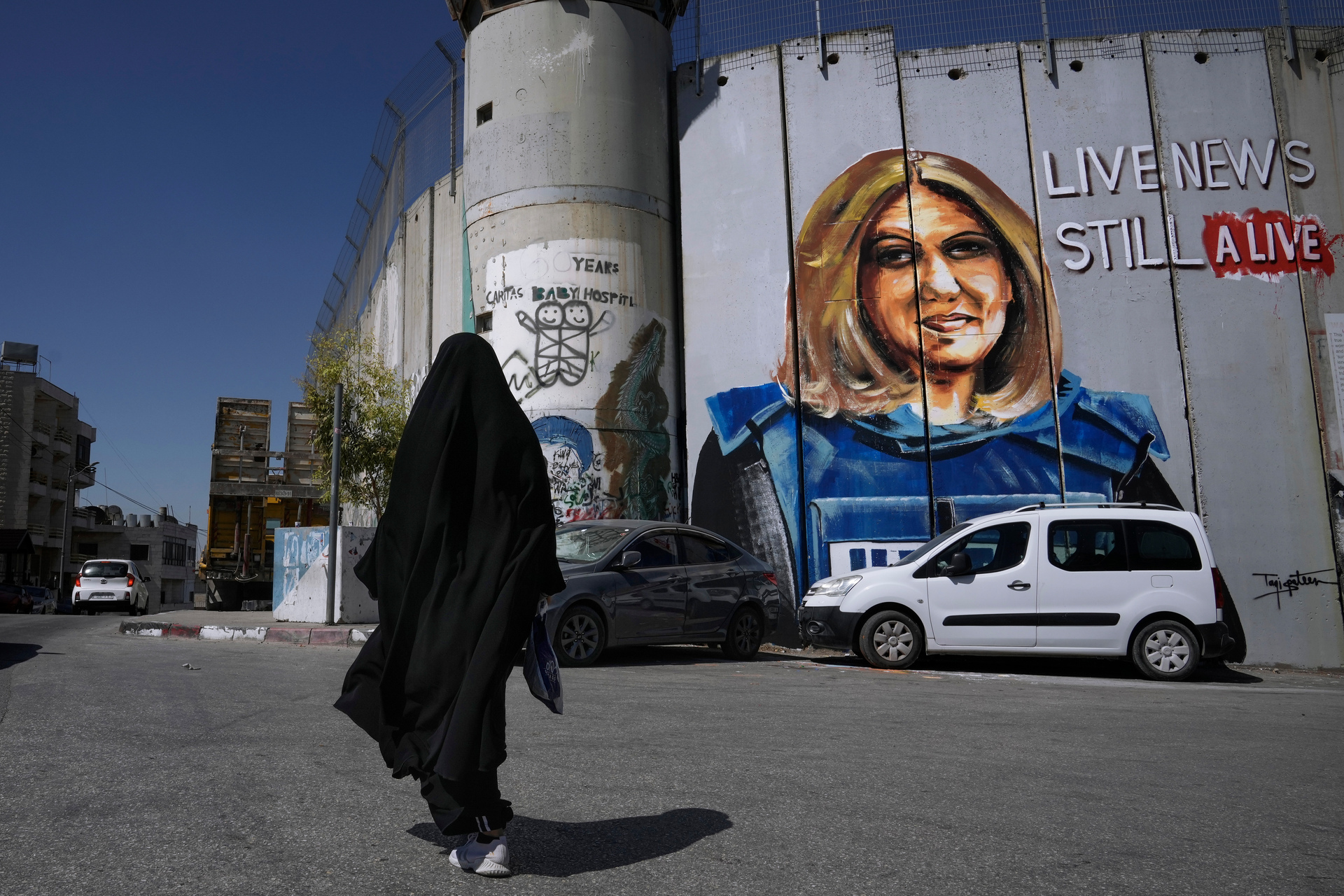A mural depicting killed Palestinian-American journalist Shireen Abu Akleh is drawn on the separation barrier in the West Bank city of Bethlehem. Photo / AP
