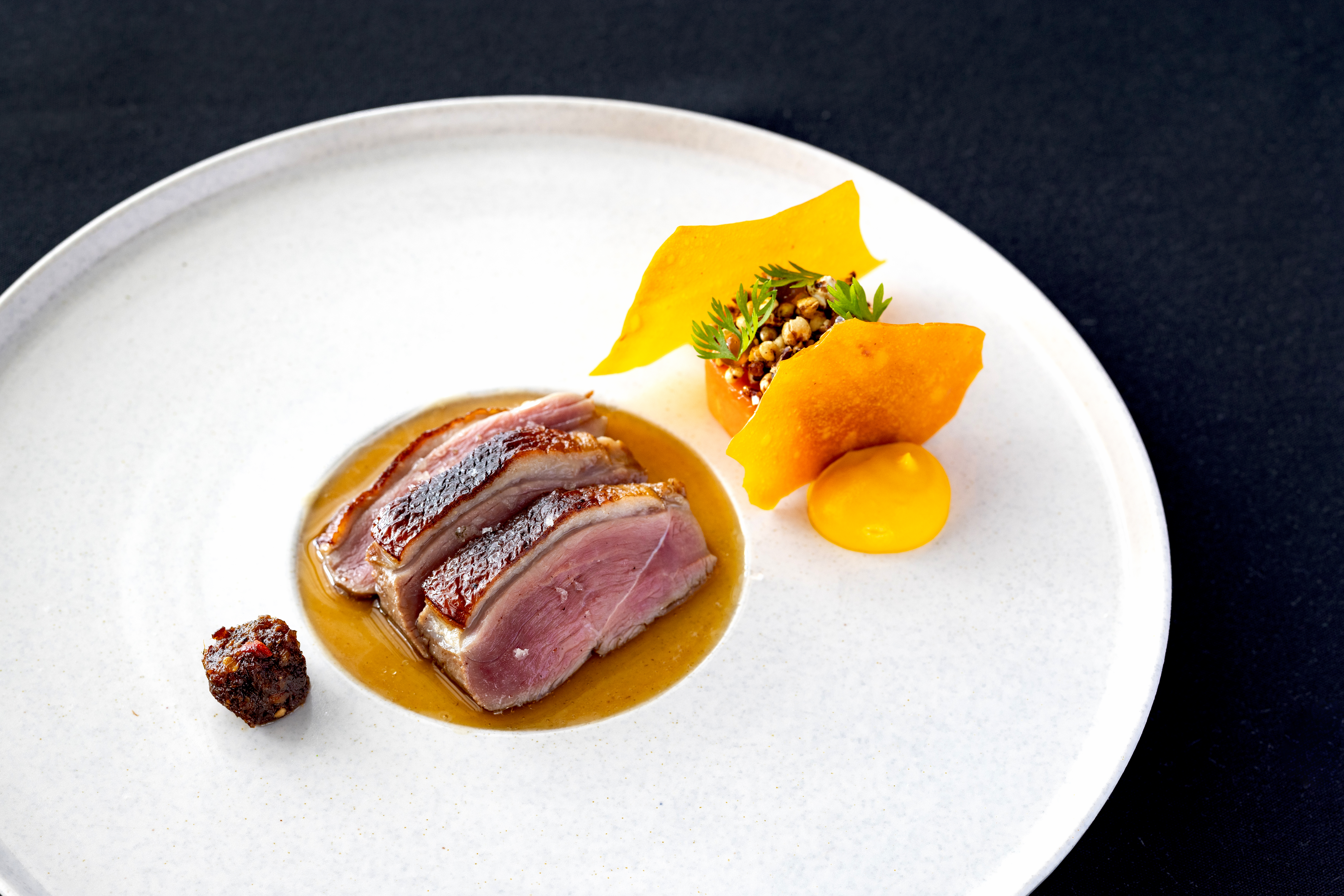 Dry-aged duck breast, confit celeriac, yeast and sherry vinegar. Photo / Babiche Martens