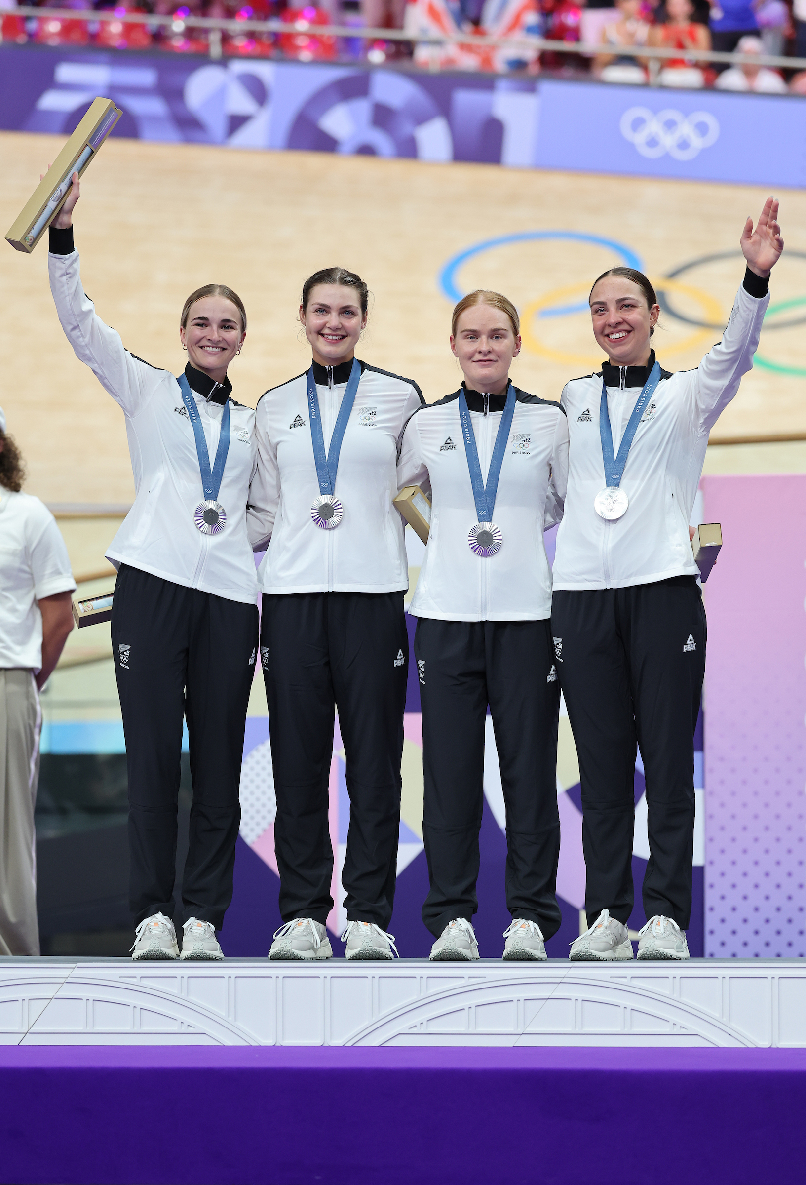 Ally Wollaston, Emily Shearman, Nicole Shields and Bryony Botha with the silver medals in the women's team pursuit at the Paris Olympics. Photo / Photosport
