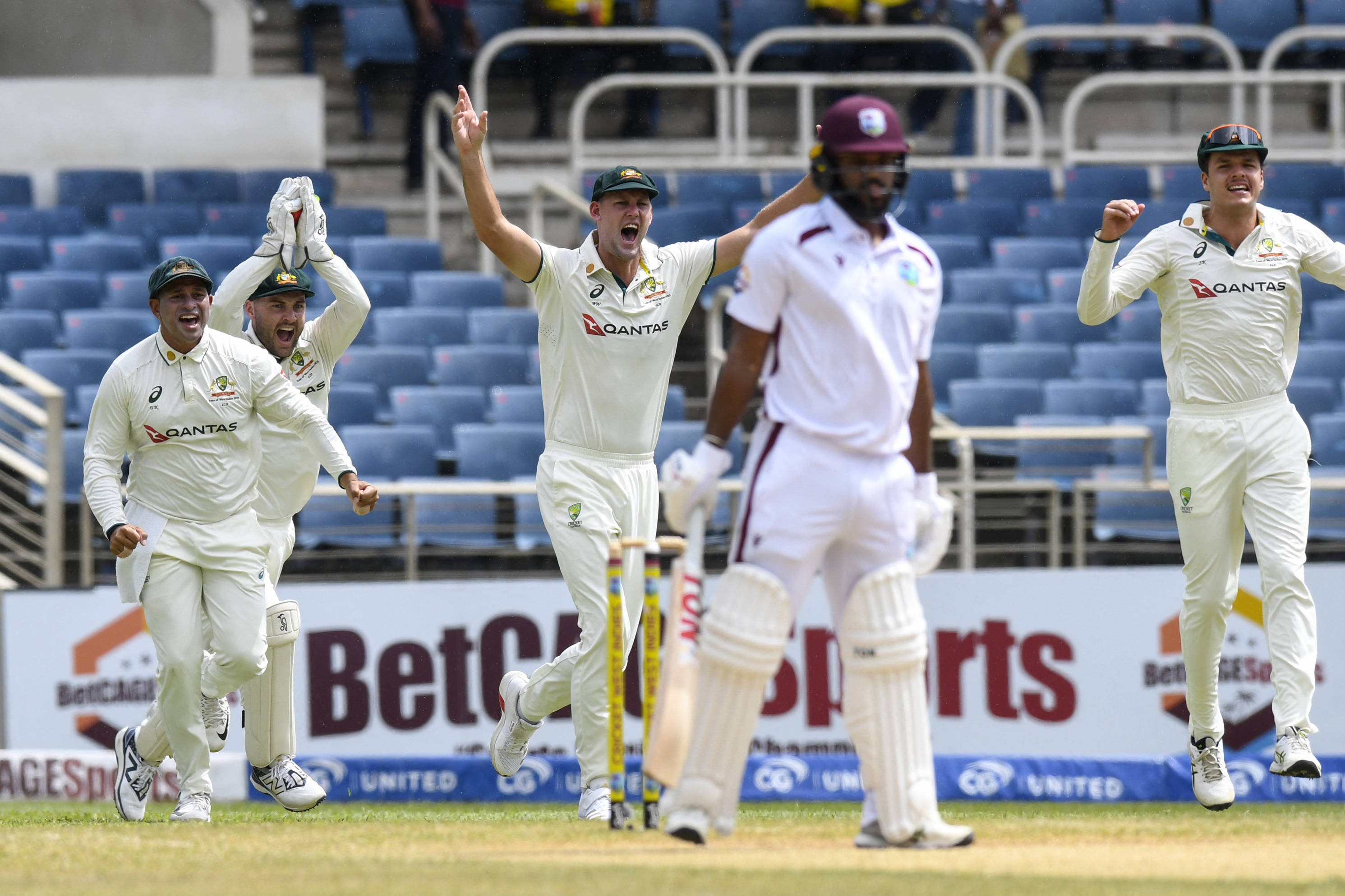 Australia celebrate the dismissal of John Campbell of West Indies. Photo / AFP