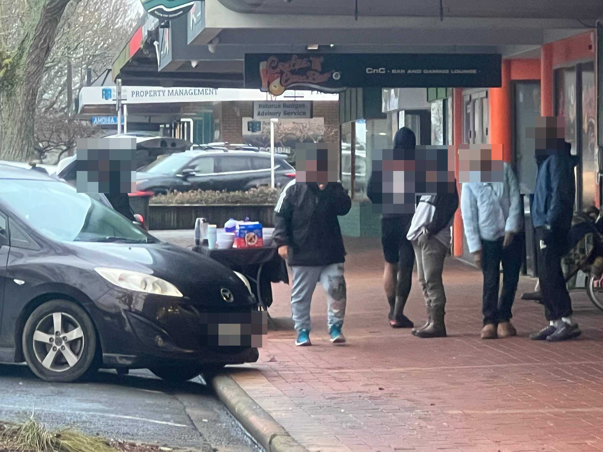  Homeless gather on Pukuatua St this week for free breakfast. Photo / Kelly Makiha