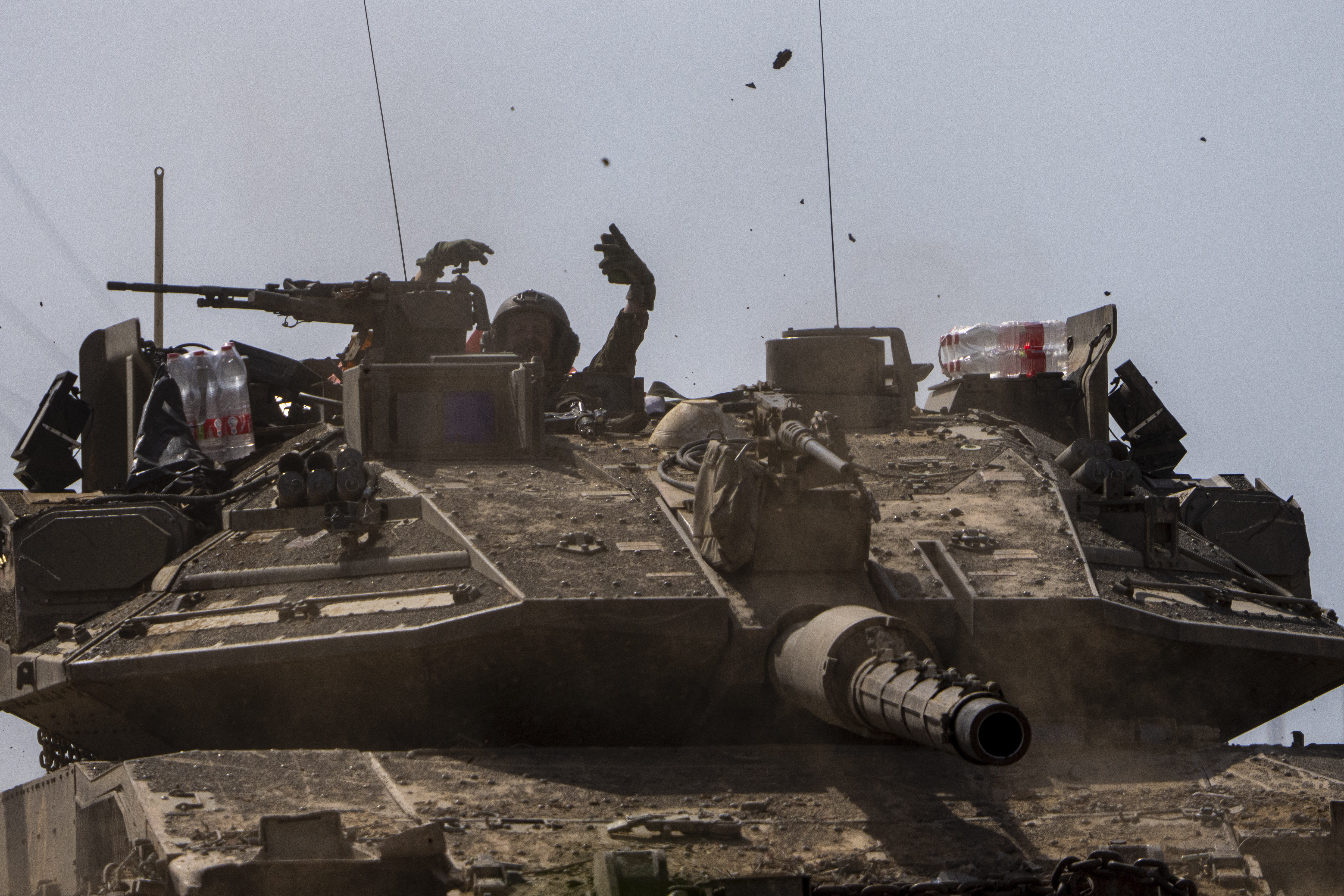 Israeli soldiers drive a tank on the border with the Gaza Strip in southern Israel. Photo / AP
