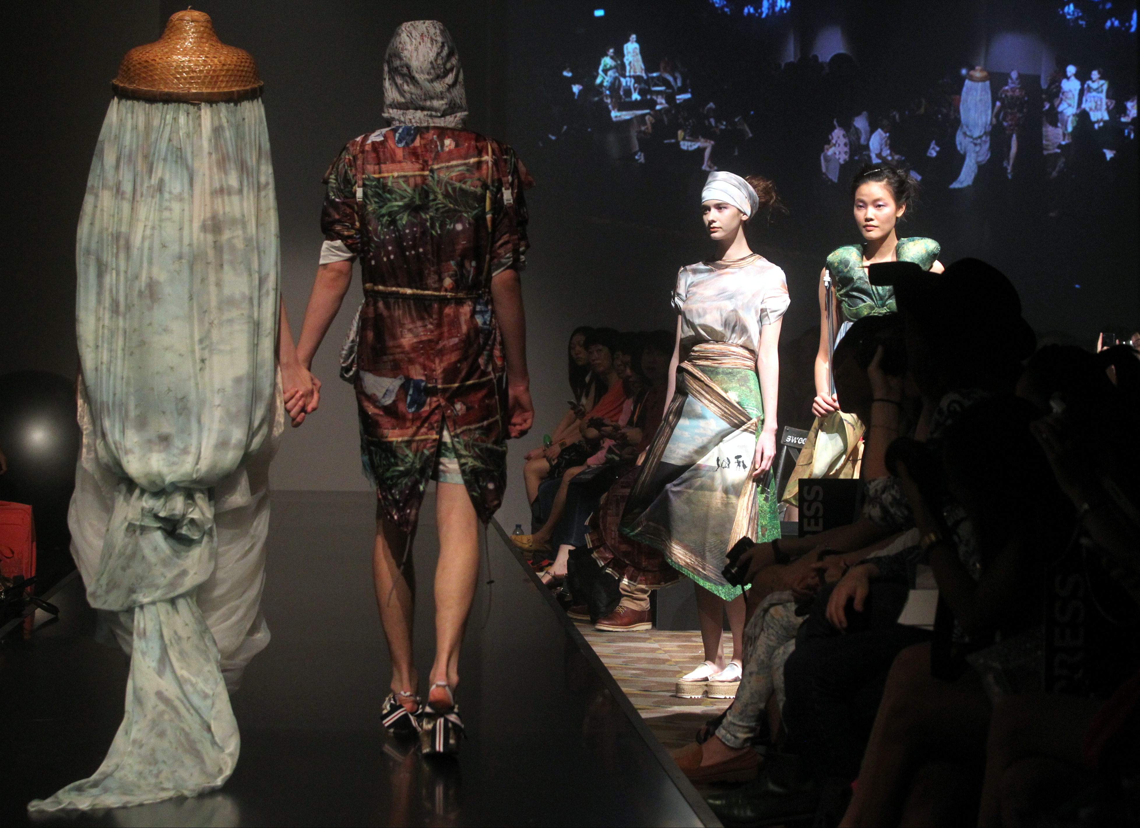 Models present clothing from Elizabeth & Jacqueline at Hong Kong Fashion Week 2013. Photo / Getty Images