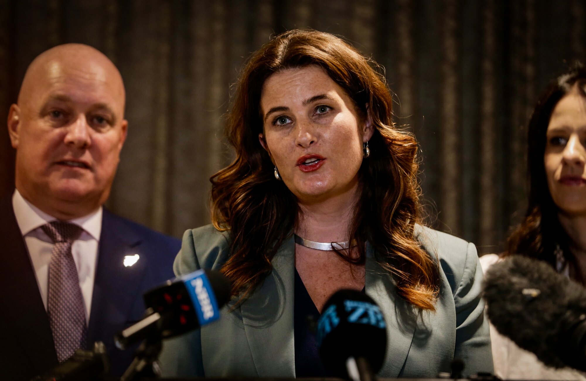 Nicola Willis (here with Christopher Luxon, left) warns the Government's finance costs are likely to be higher than expected. Photo / Alex Burton