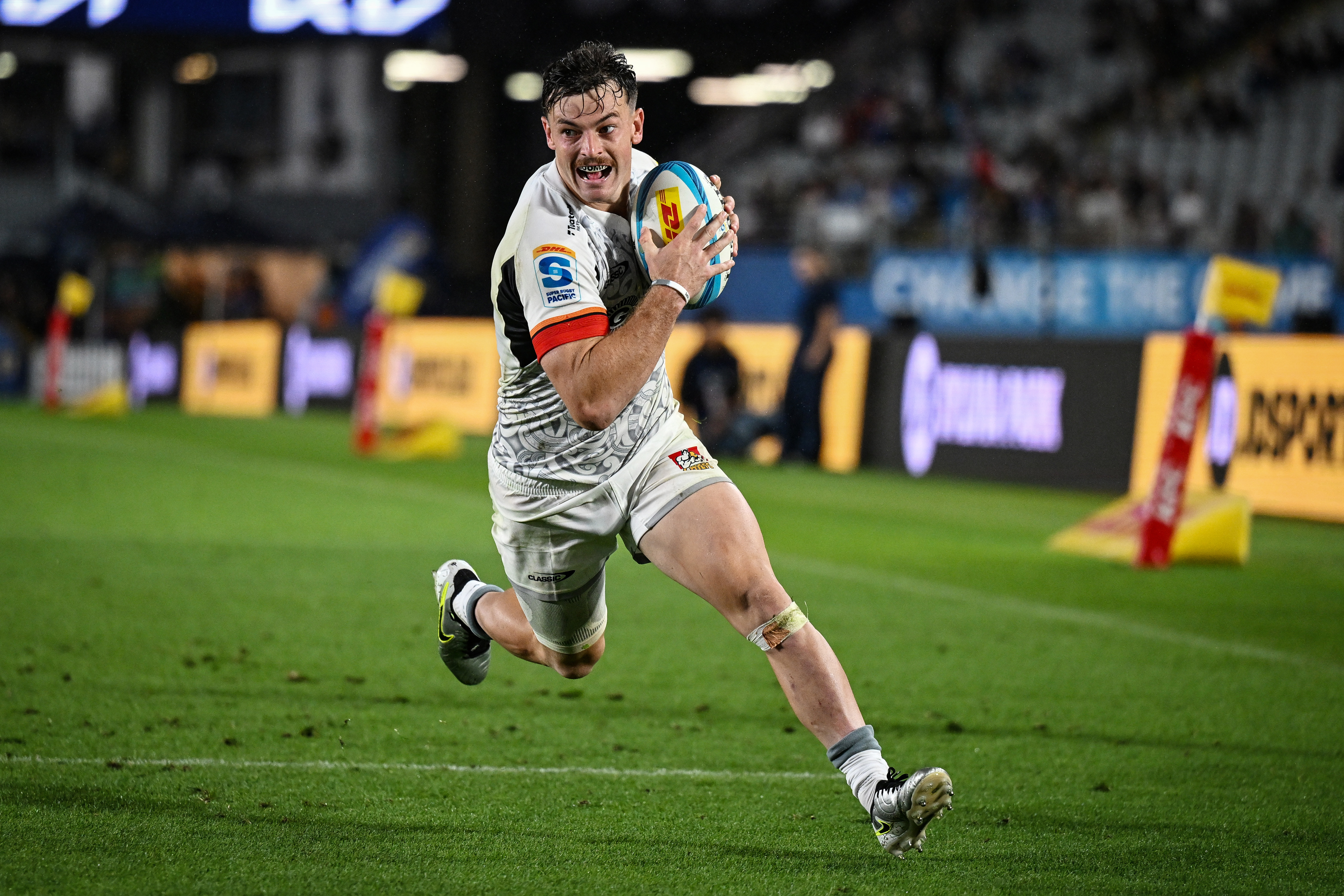 Leroy Carter heads for the tryline in Chiefs colours. Photo / Photosport