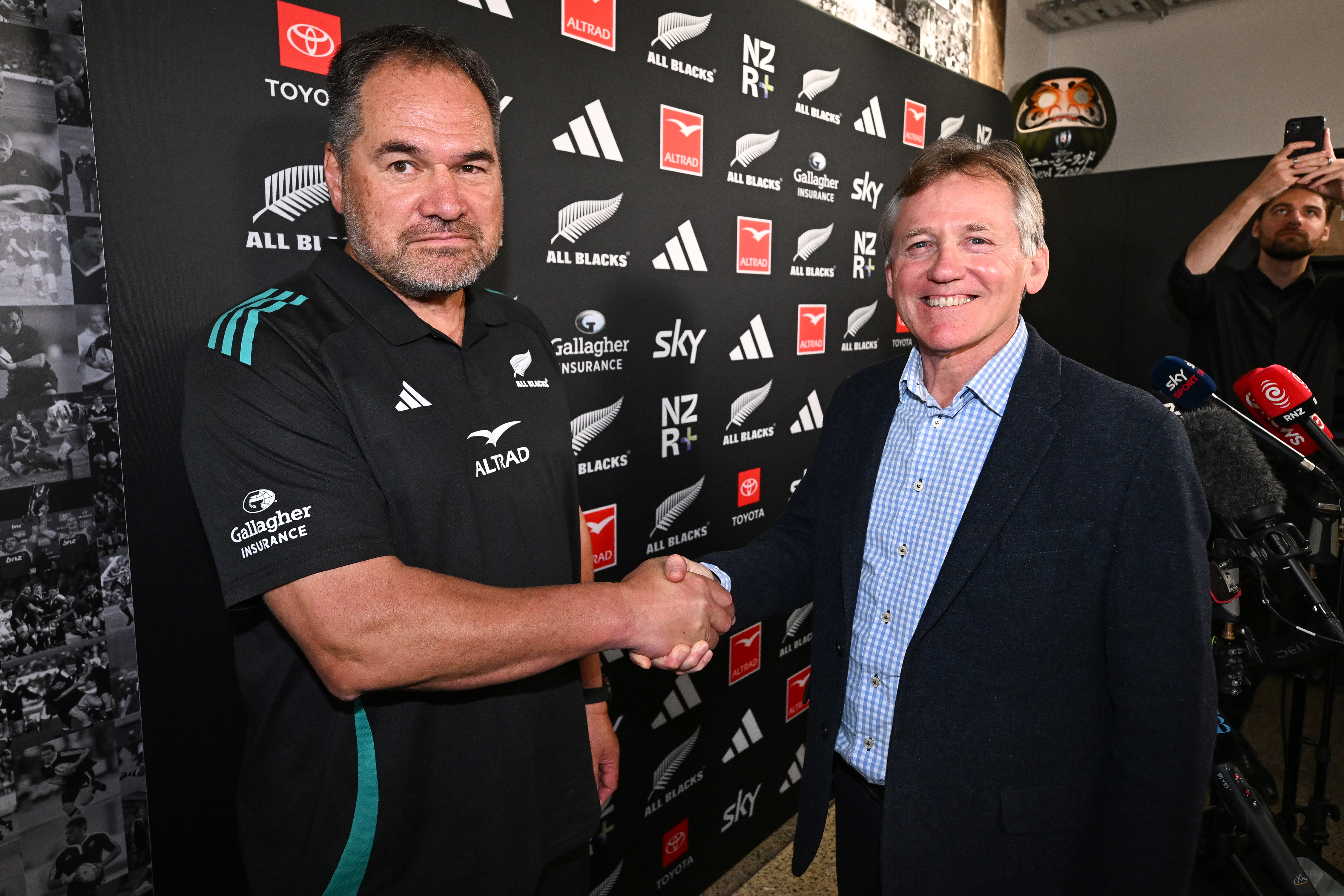 All Blacks coach Dave Rennie (left) and New Zealand Rugby chair David Kirk shake hands at the New Zealand Rugby press conference. Photo / Photosport