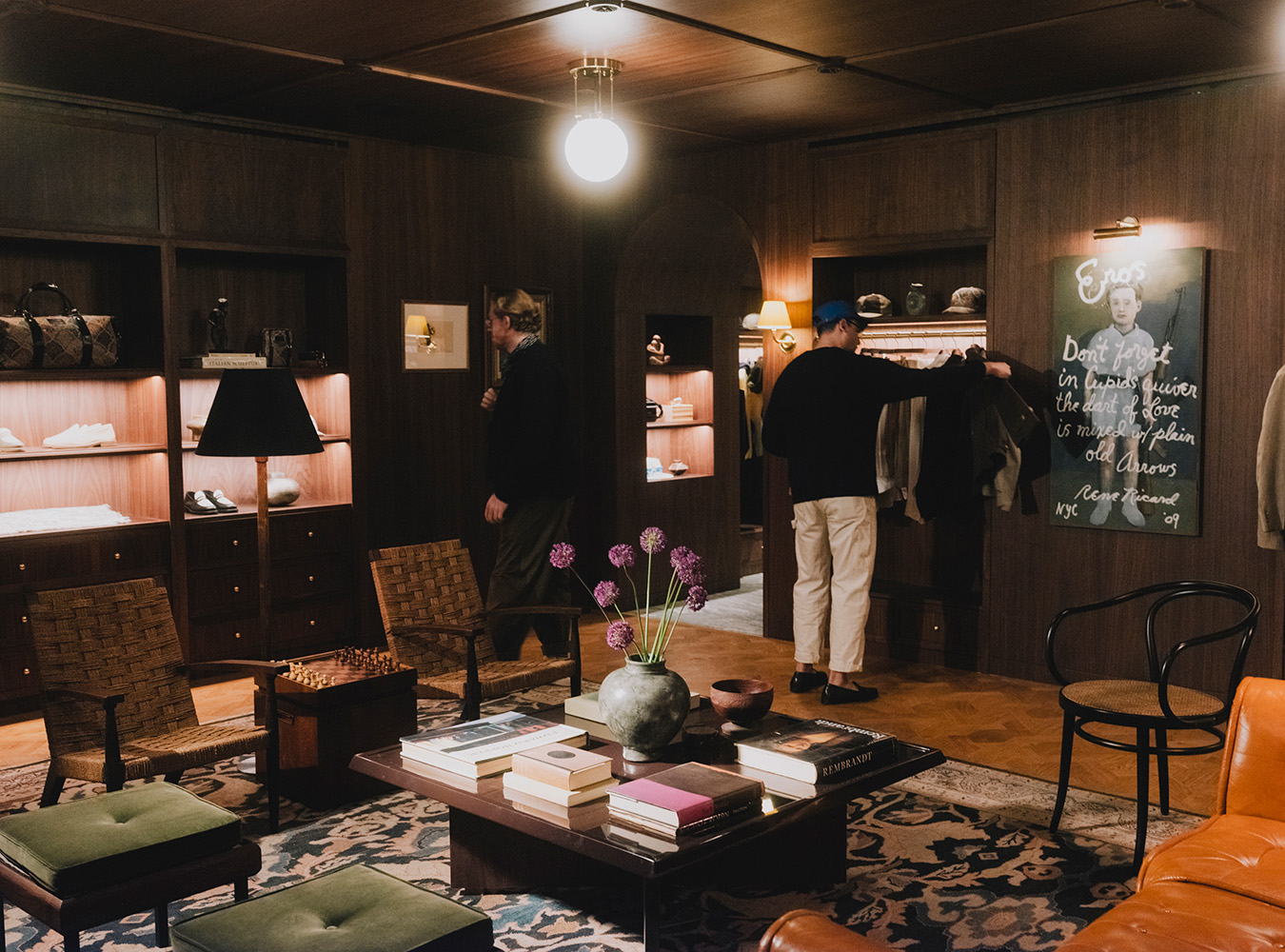 The ALD store is on Mulberry Street in Manhattan, warmed with dark wood tones and featuring a Rene Ricard painting. Photo / Christopher Lee, The New York Times