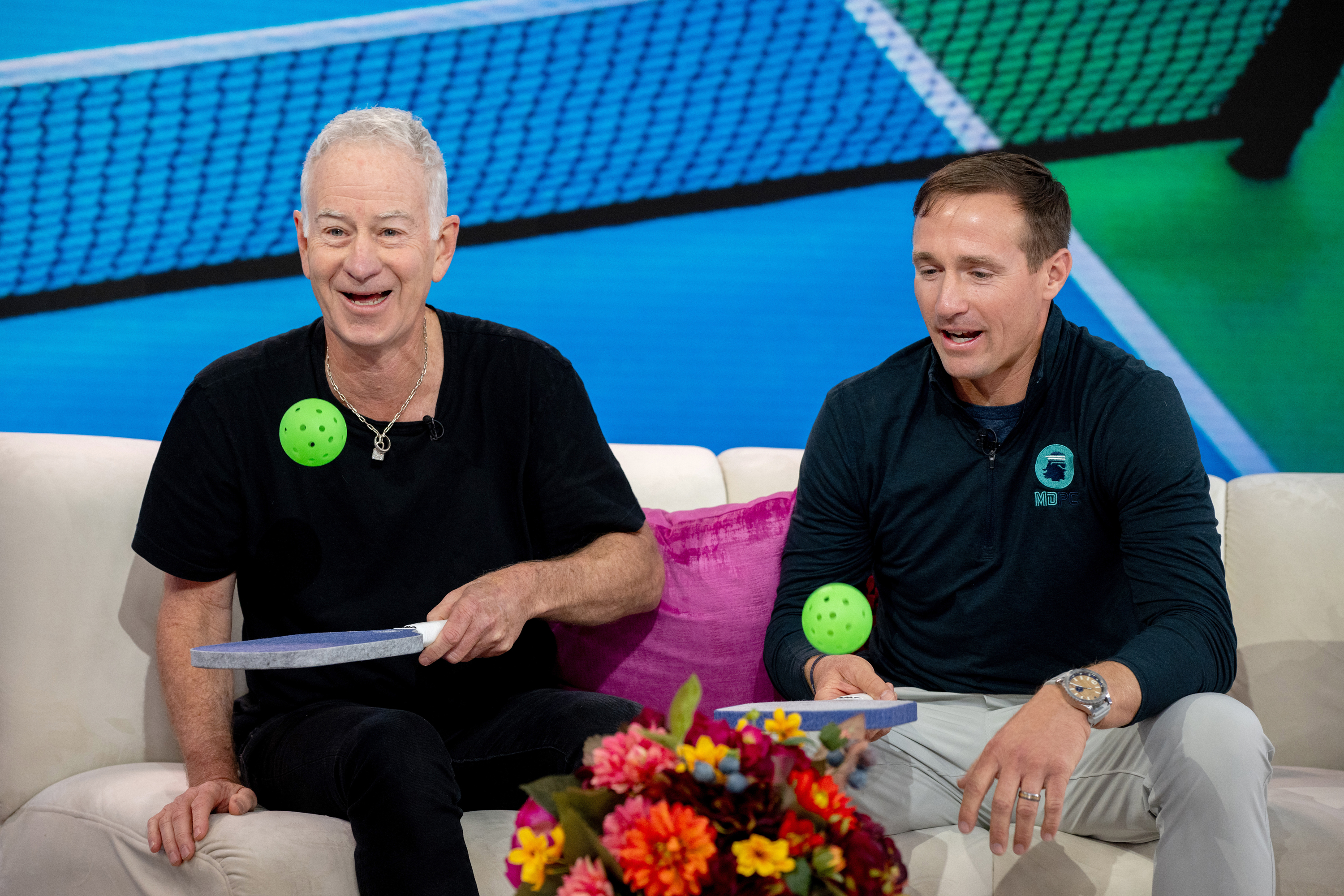 Tennis icon John McEnroe (left) and former NFL star Drew Brees (right) are some of pickleball's growing celebrity playerbase. Photo / Getty Images