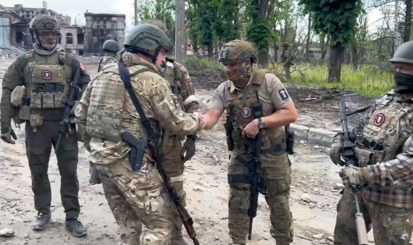 Yevgeny Prigozhin, the owner of the Wagner Group military company, shakes hands with his soldiers, in Bakhmut, Ukraine. Photo / AP