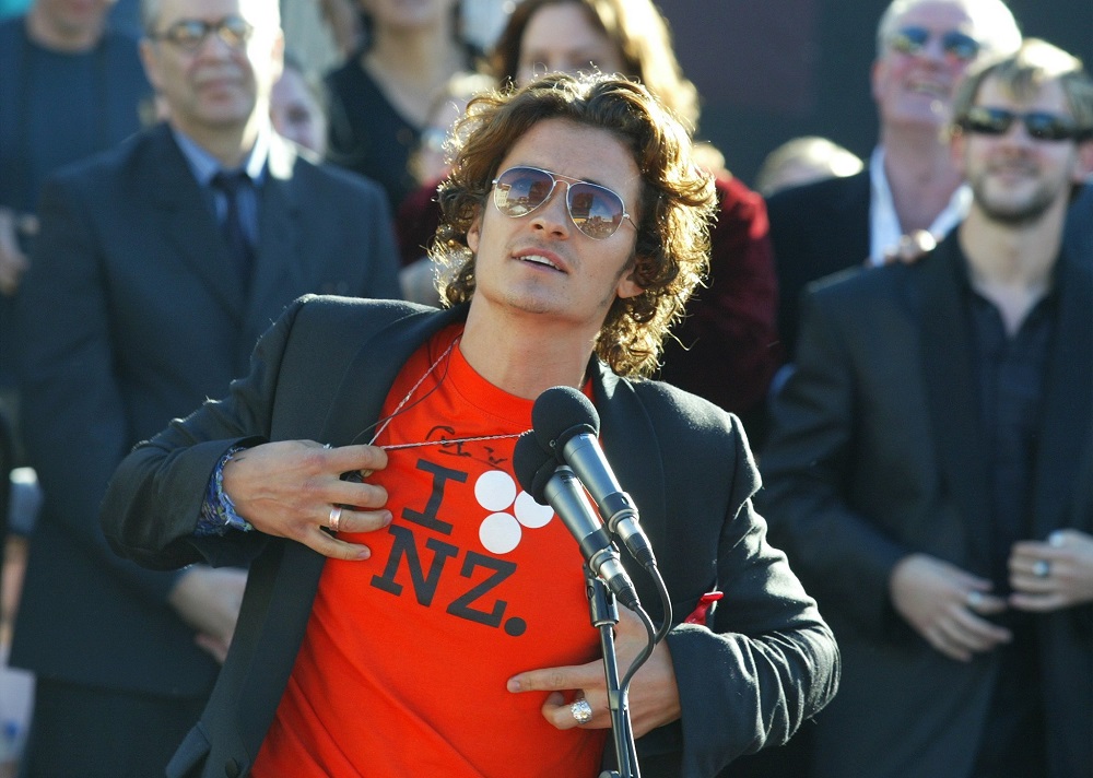 Orlando Bloom confesses his love for NZ with the iconic Huffer Luv T-shirt at the Lord of the Rings premiere in Wellington, 2003. Photo / Mark Mitchell 