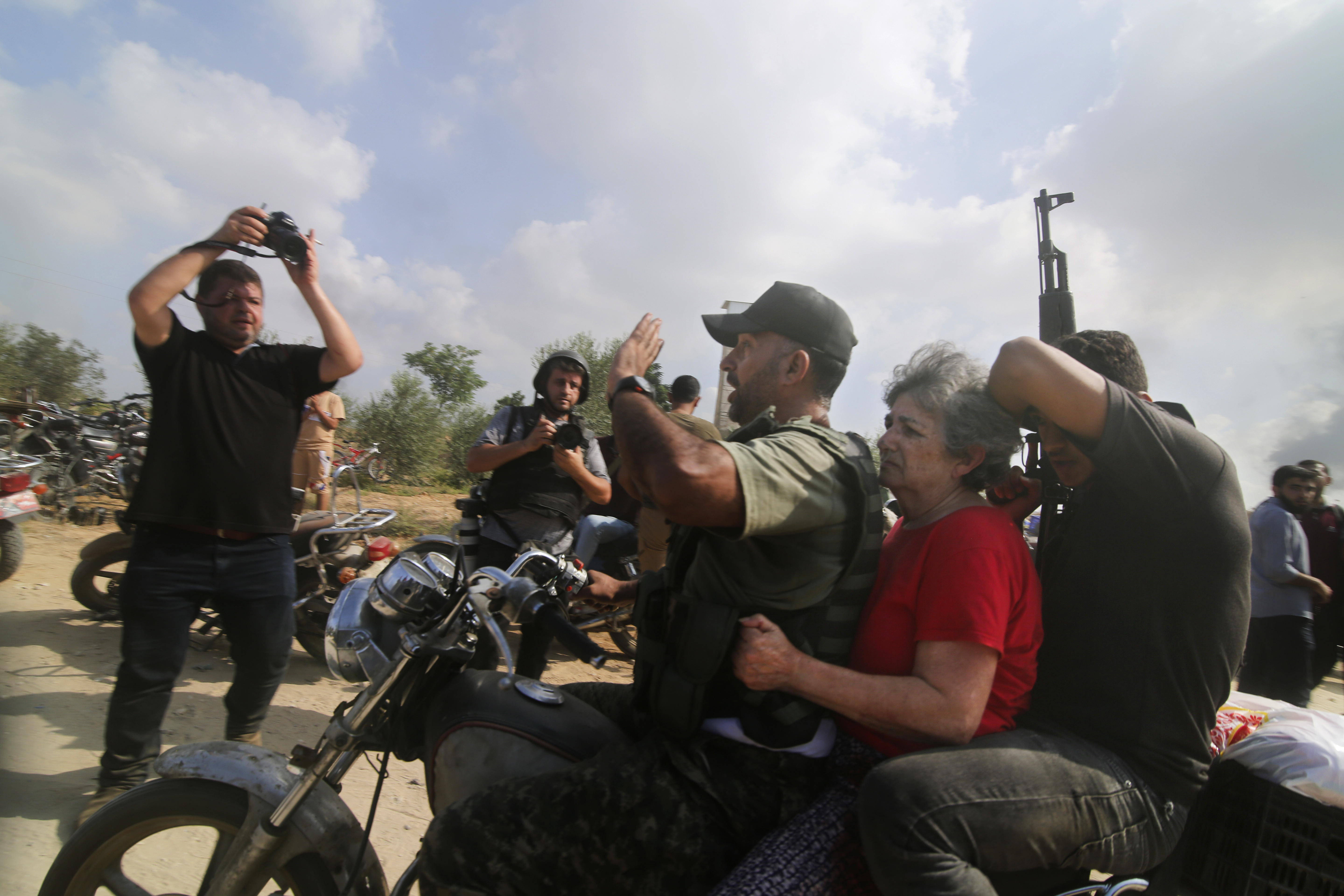 Palestinians transport captured Israeli civilian Adina Moshe from her home in Kibbutz Nir Oz to the Gaza Strip. Photo / AP