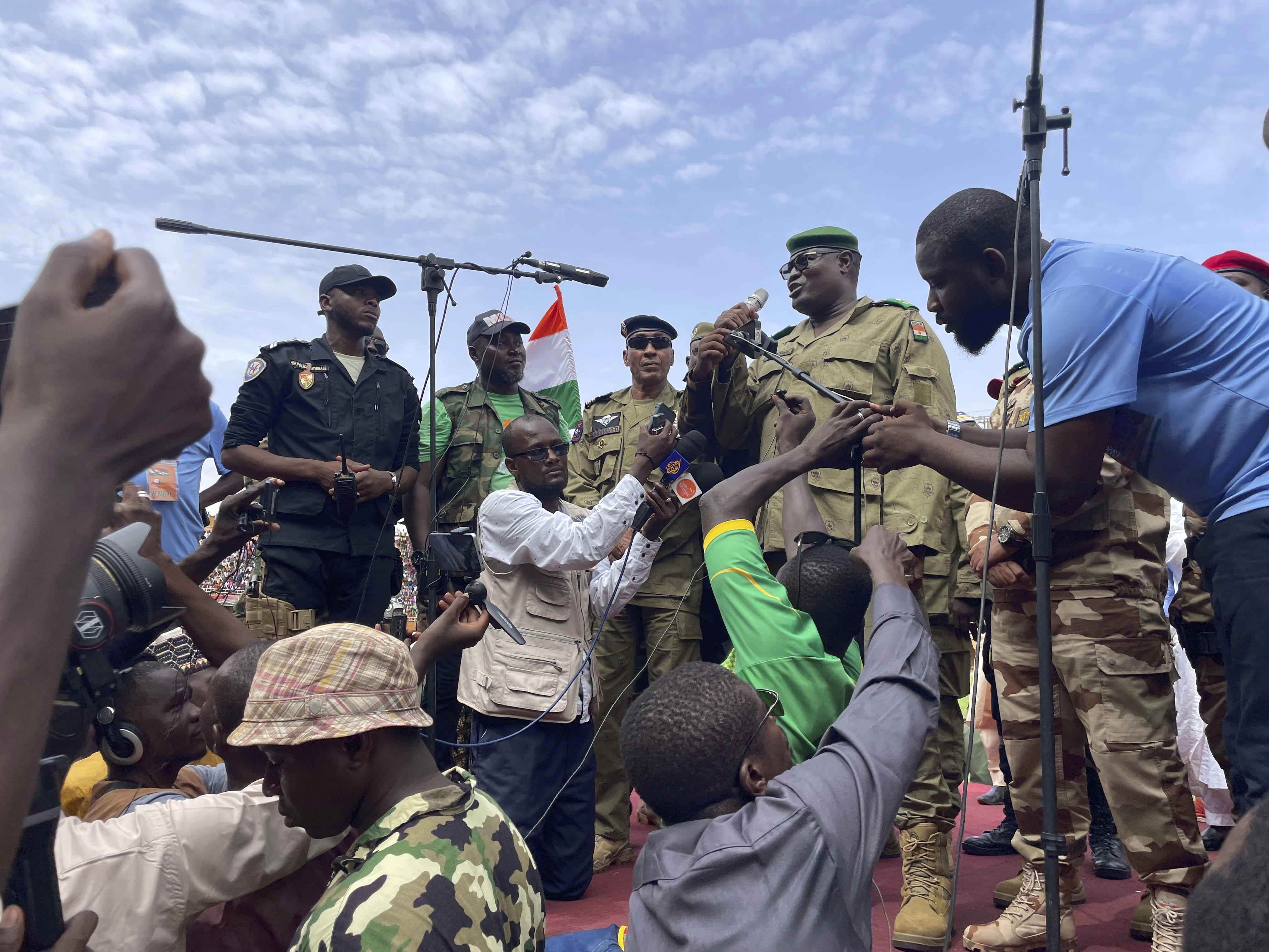Mohamed Toumba, one of the soldiers who ousted Nigerien President Mohamed Bazoum, addresses supporters of Niger's ruling junta in Niamey, Niger on Sunday. Nigerians are bracing for a possible military intervention. Photo / AP