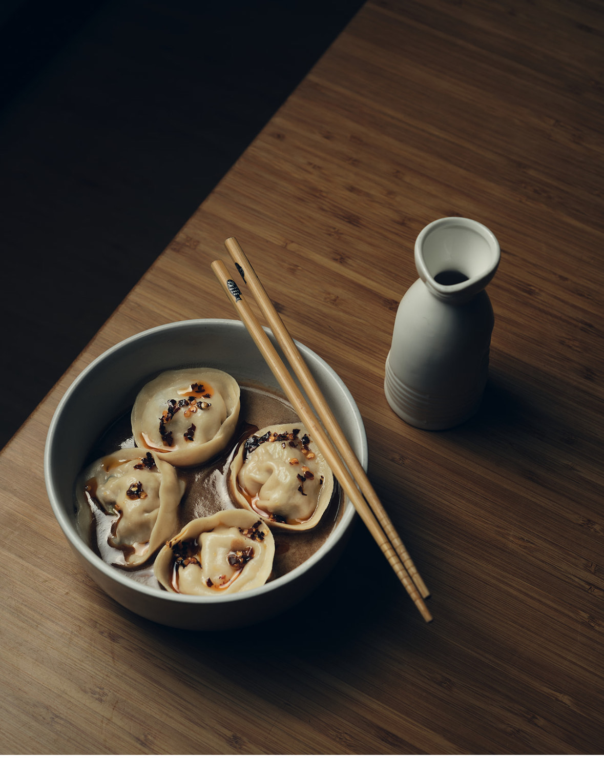 Koji's chicken and prawn dumplings with sesame, black vinegar, soy and chilli.