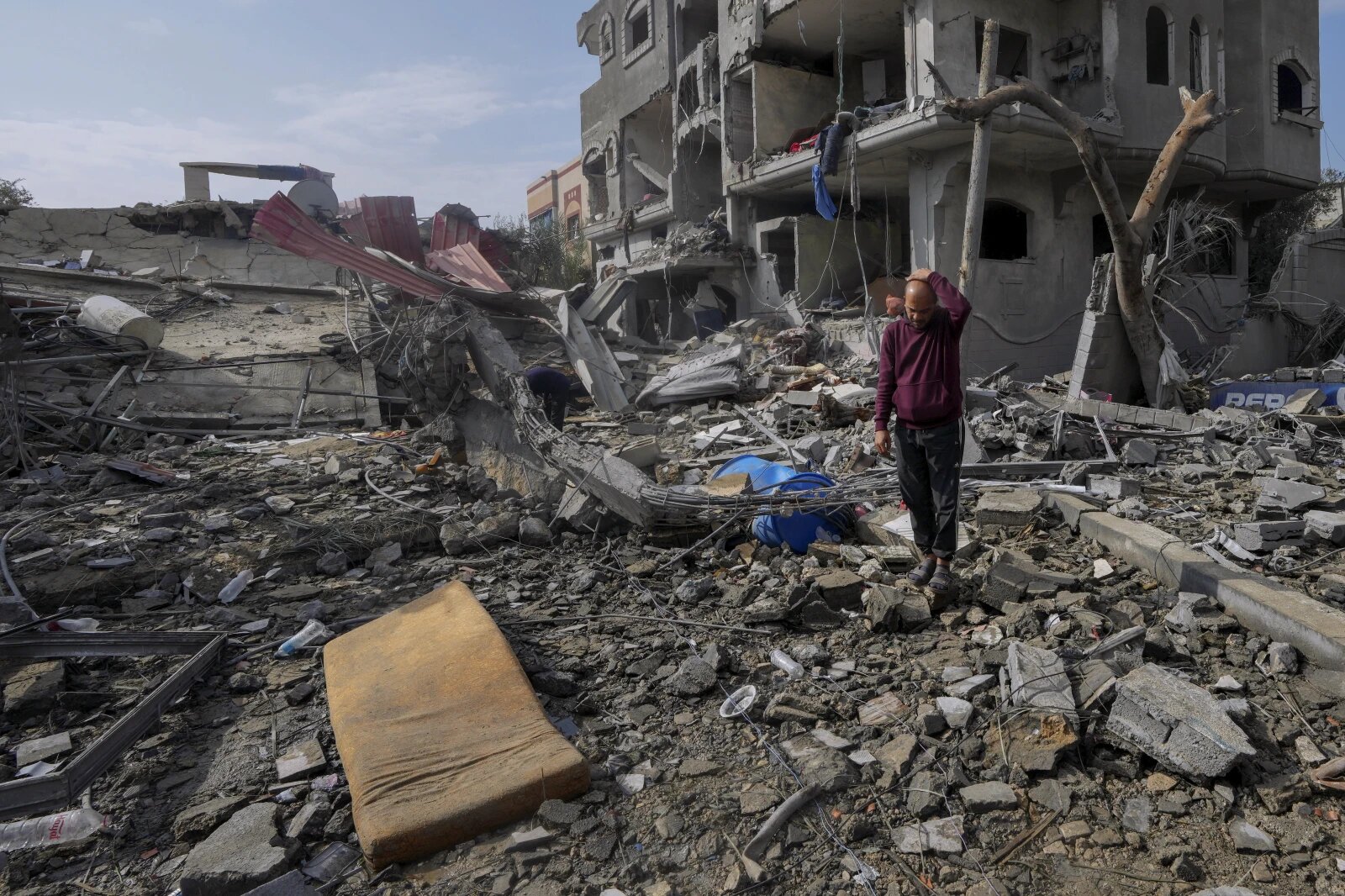 Palestinians inspect the rubble of a building destroyed in an Israeli strike in Maghazi refugee camp, central Gaza Strip. Photo / AP