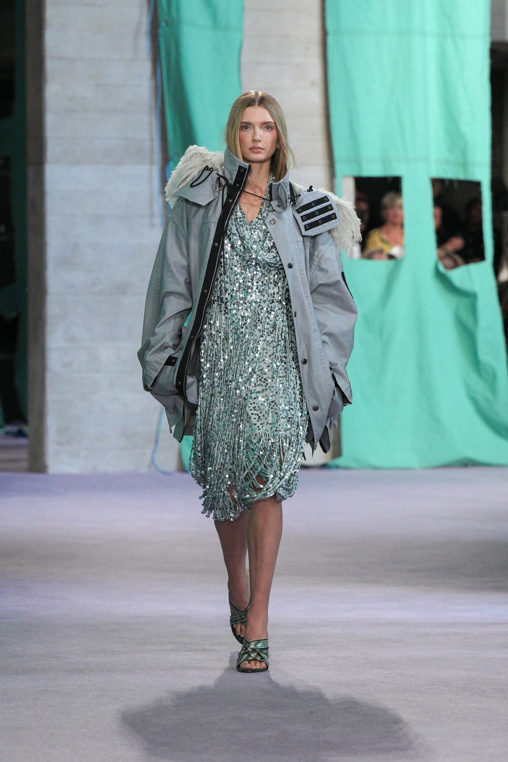Oversized parkas and a dash of dazzle defined Daniel Lee's renewed focus on Britishness in his latest Burberry collection, presented at London Fashion Week.