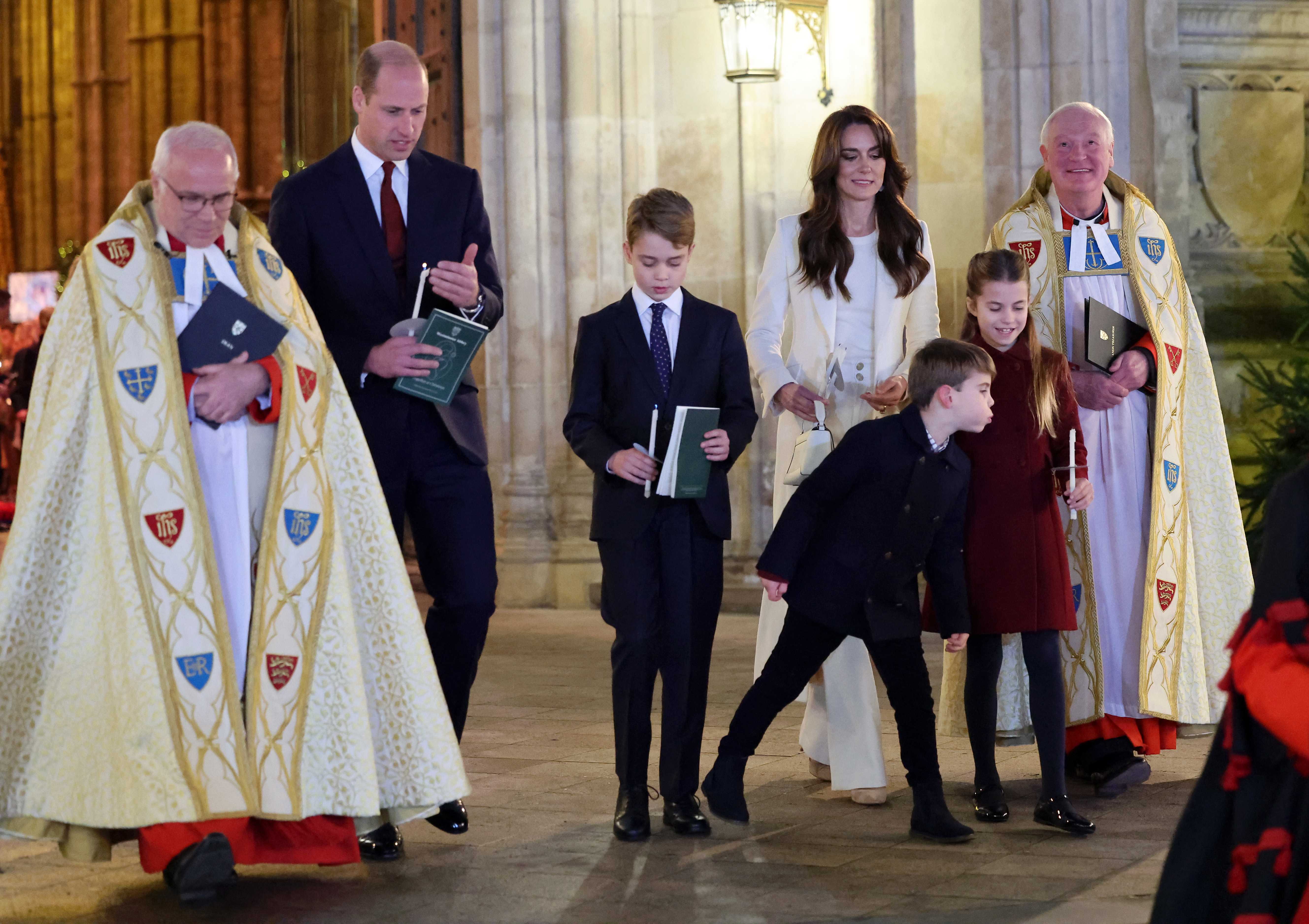 Prince Louis blows out his sister's candle. Photo / Getty Images