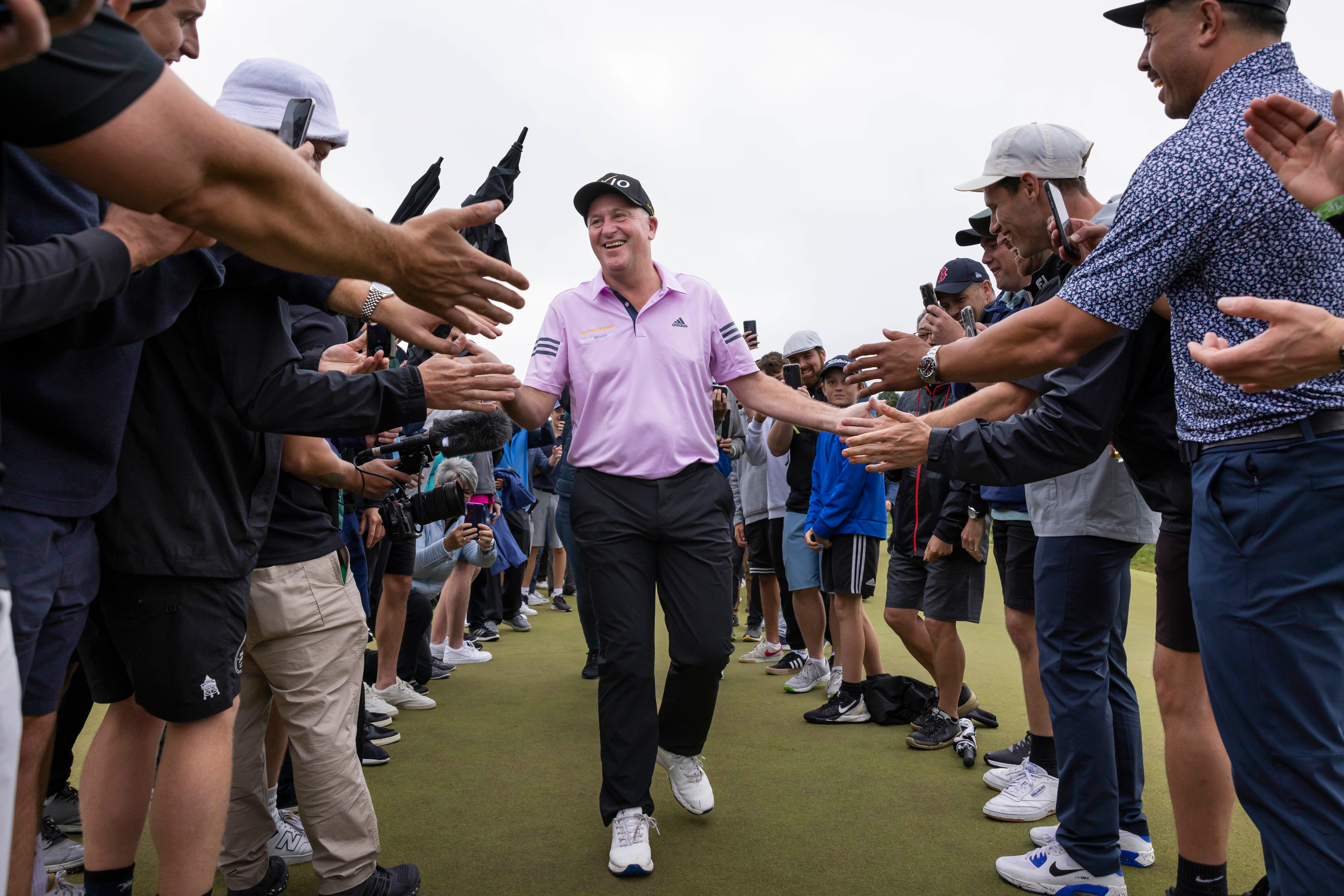 Sir John Key walked through a guard of honour set up for him after making his first-ever ace. Photo / Brett Phibbs, www.photosport.nz