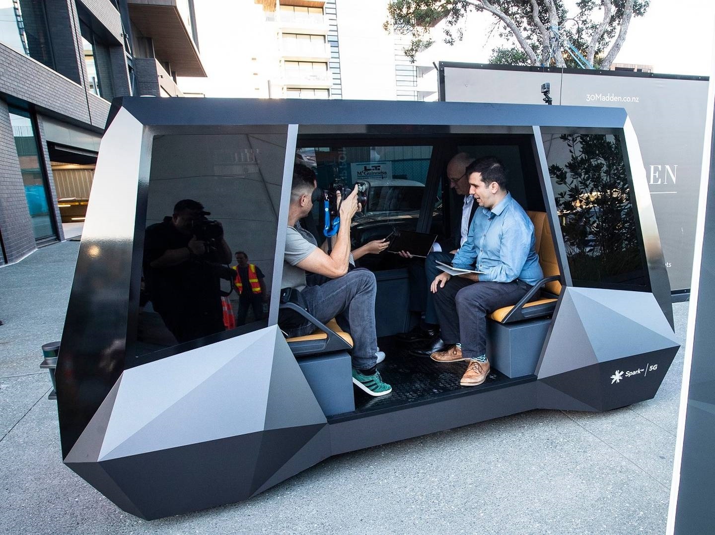 Emerging tech leaders - Ohmio's Mahmood Hikmet in one of his company's self-driving electric vehicles, modified for a Spark 5G promotion. Photo / Chris Keall