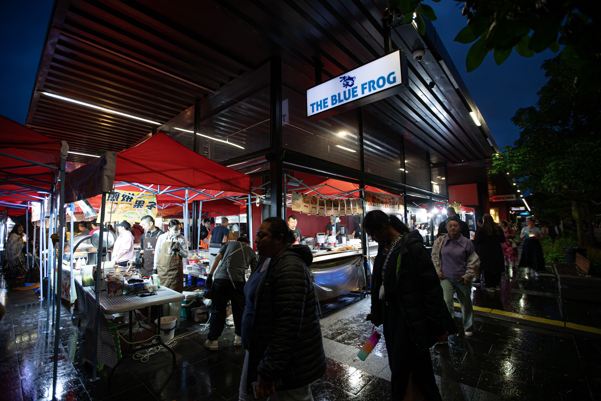 Kiwis welcomed in the New Year drenched by widespread downpours, but it didn’t seem to dampen the spirits of most. Photo / Hayden Woodward