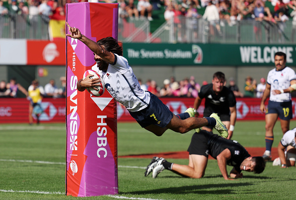 Pol Pla, of Spain, scores against the All Blacks Sevens in Dubai. Photo / Getty Images